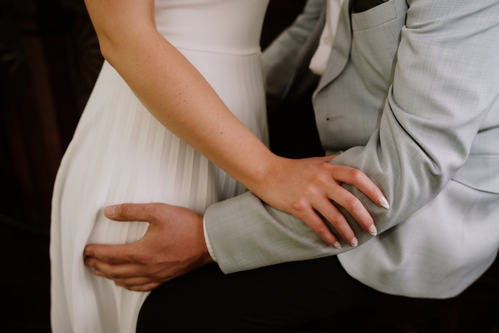 couple wearing silver-colored rings
