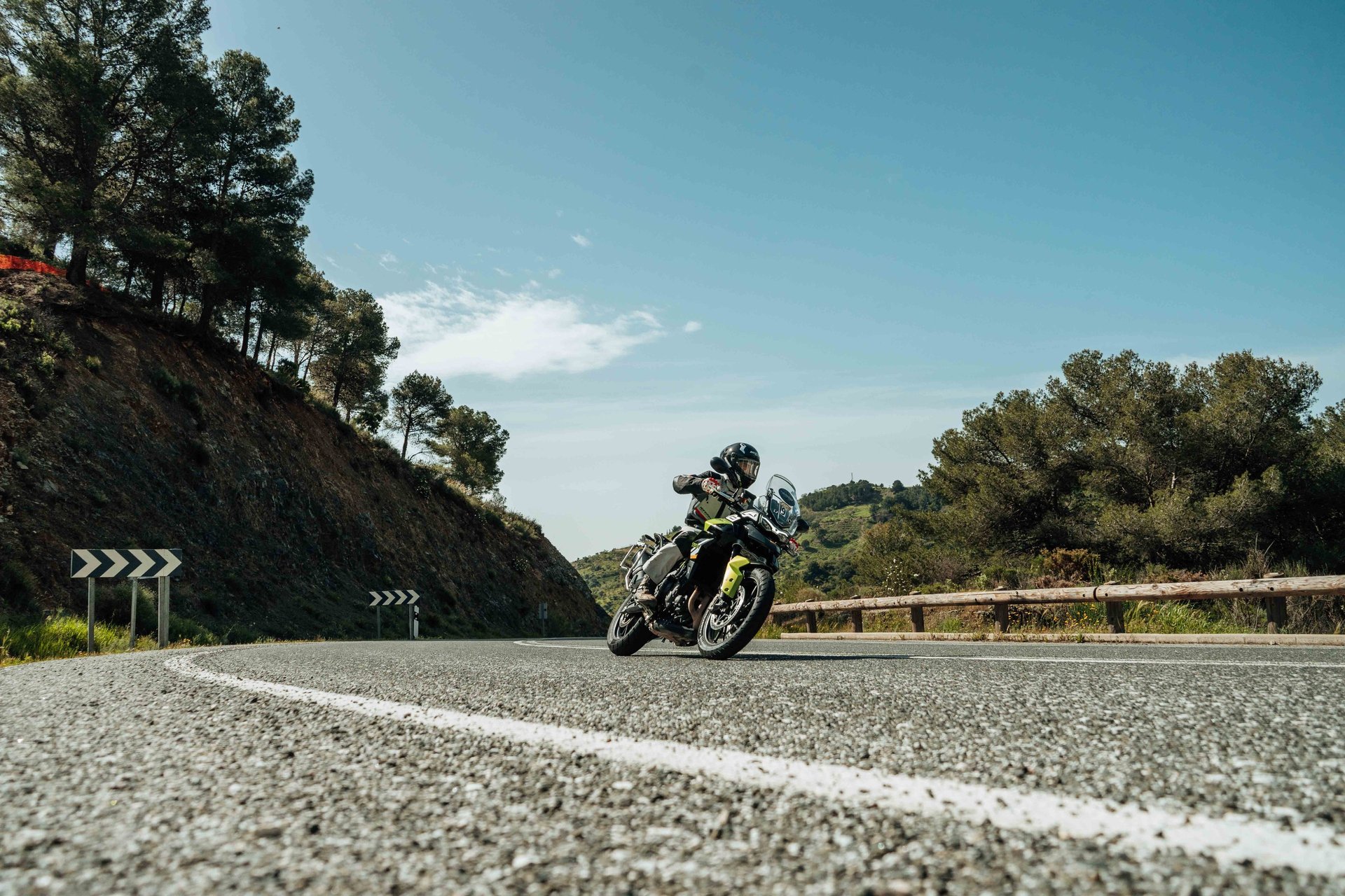 a man riding a dirt bike on a dirt road