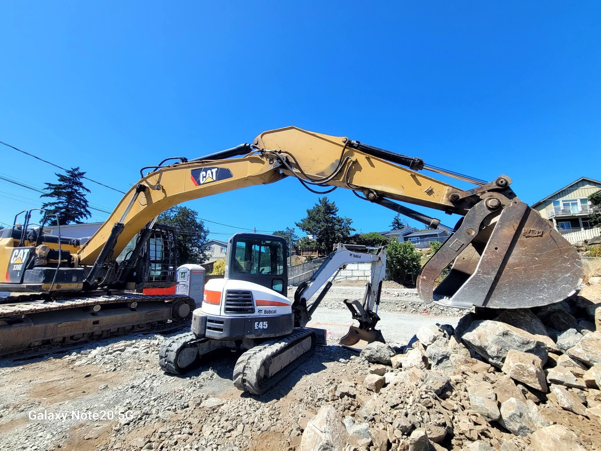 woman wearing yellow long-sleeved dress under white clouds and blue sky during daytime