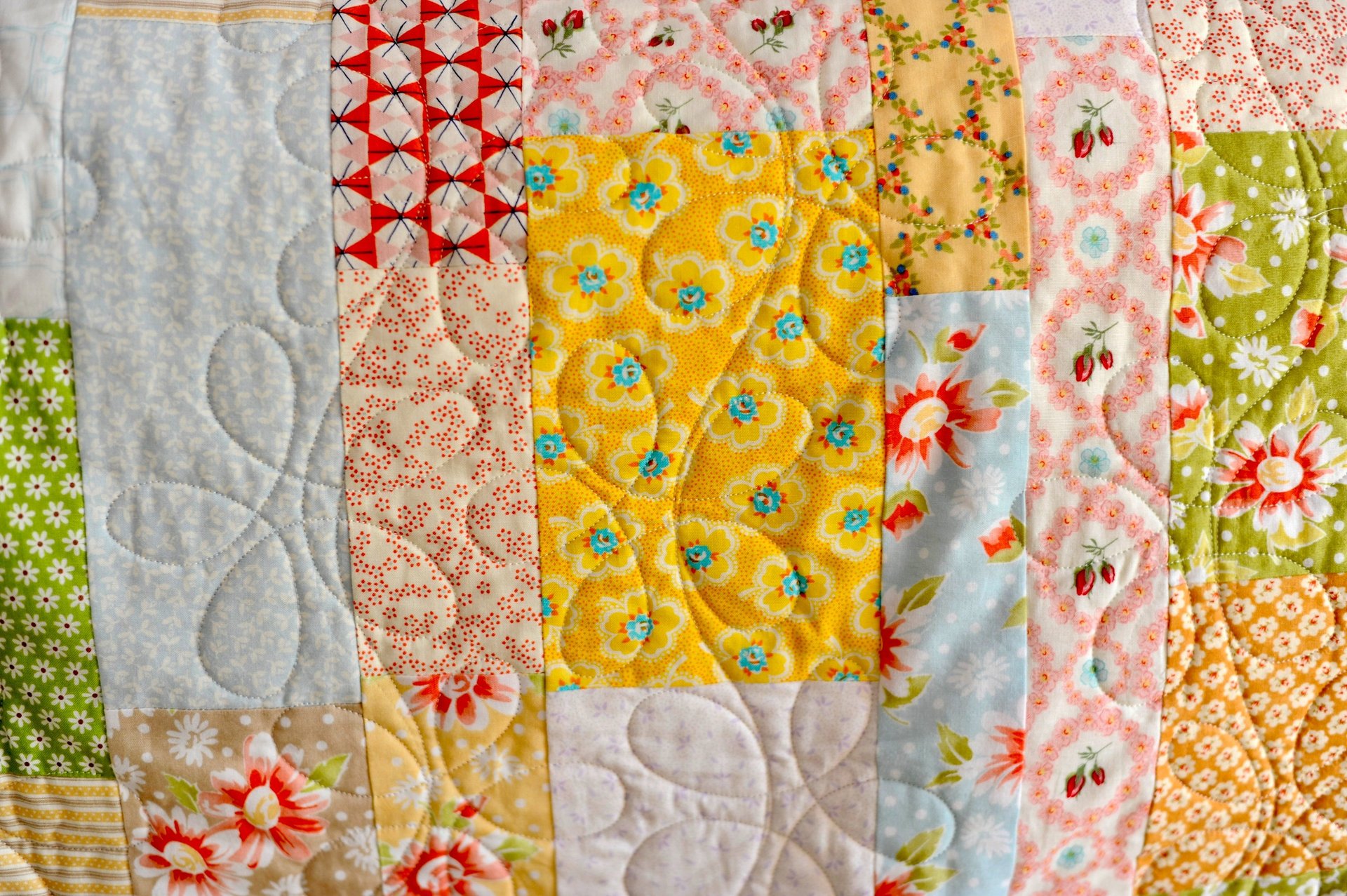 an abstract photo of a curved building with a blue sky in the background