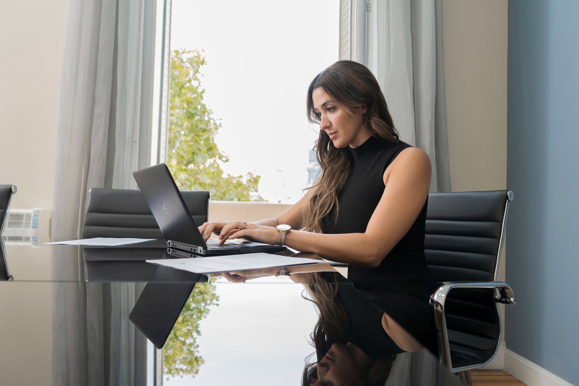 an abstract photo of a curved building with a blue sky in the background