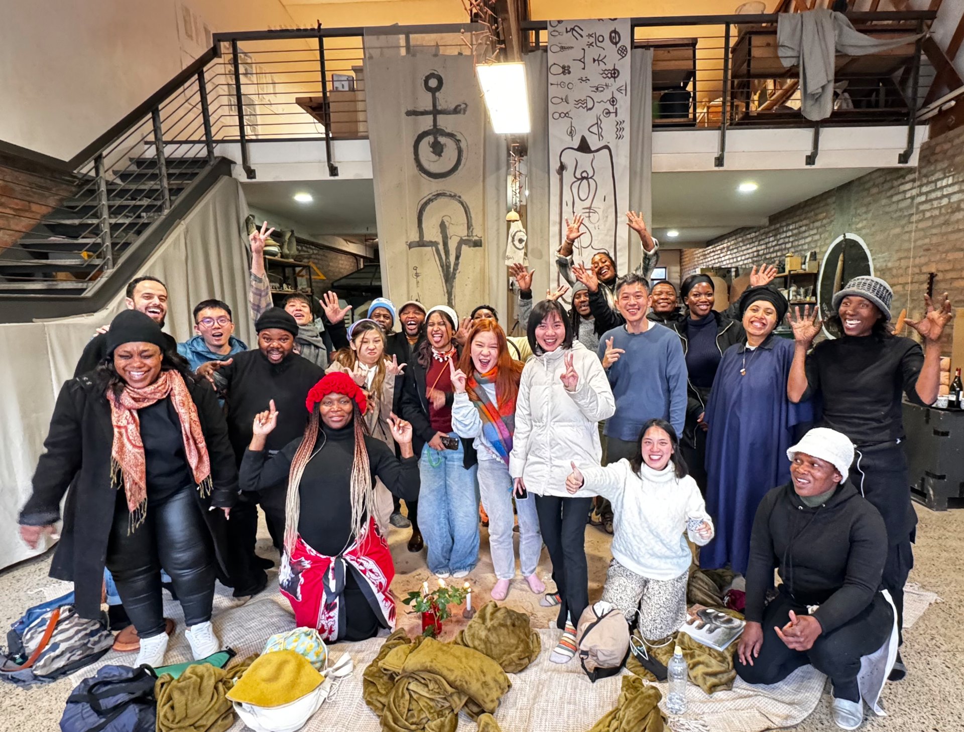 man in red crew neck t-shirt standing beside woman in blue and white plaid shirt