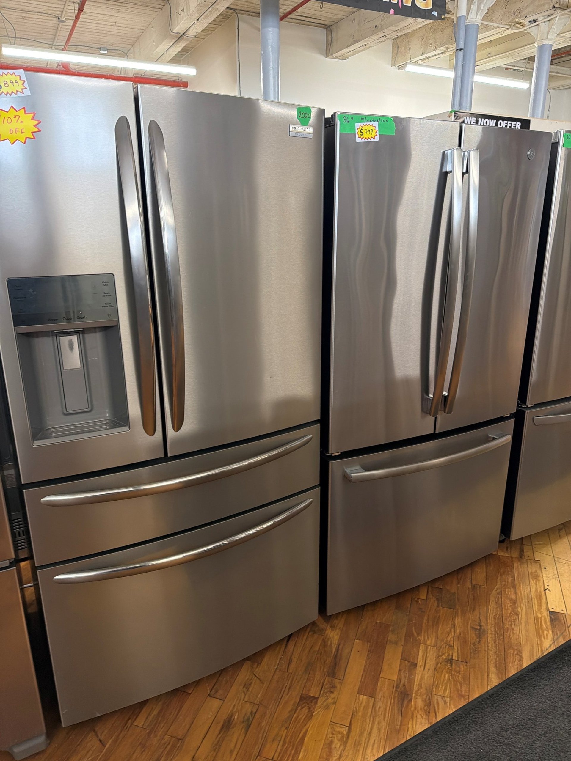 a delivery truck driving down a street next to tall buildings