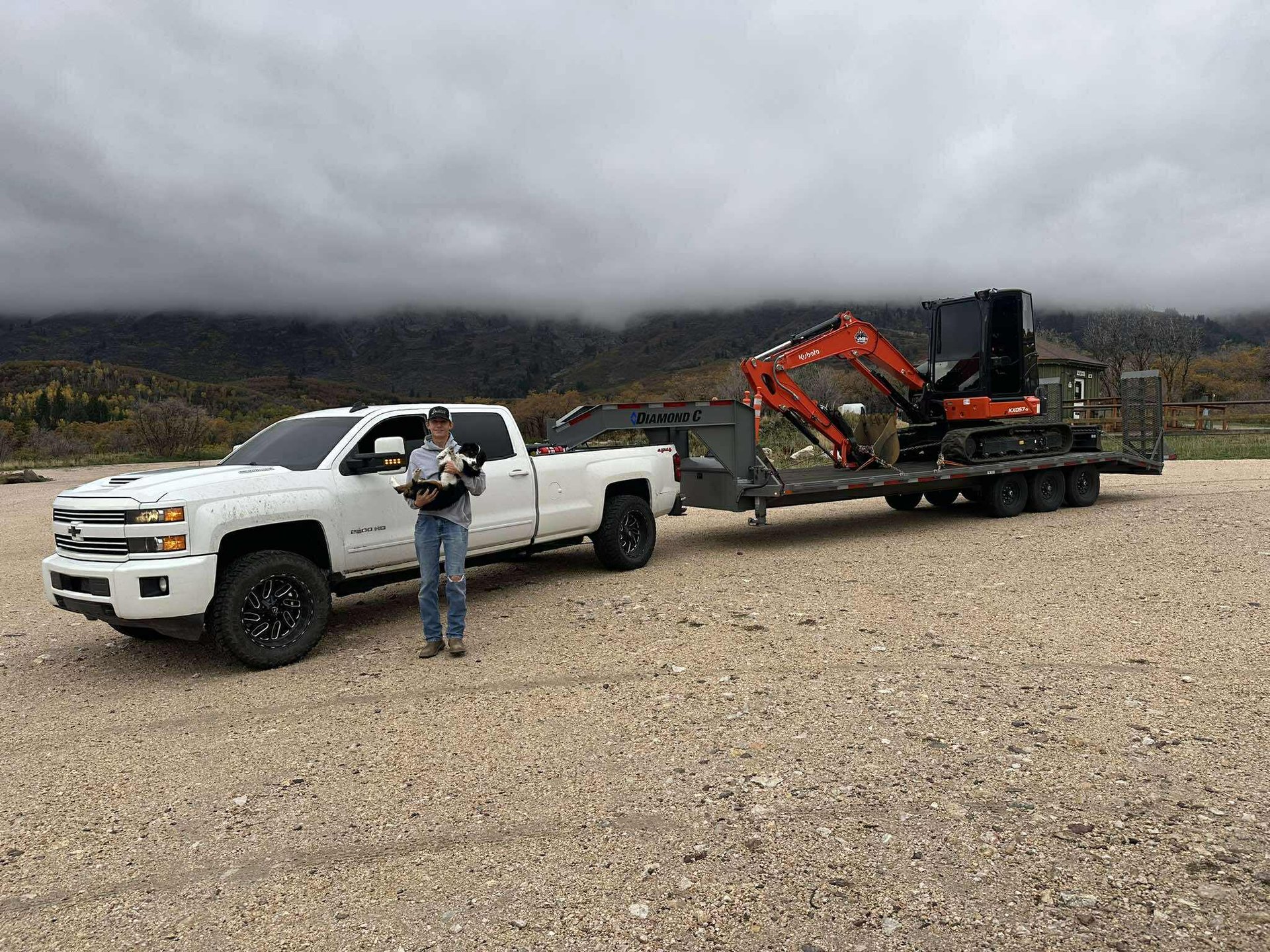 Jake Baggs, Owner of JMB Earthworks, with Chevy Truck pulling a trailer