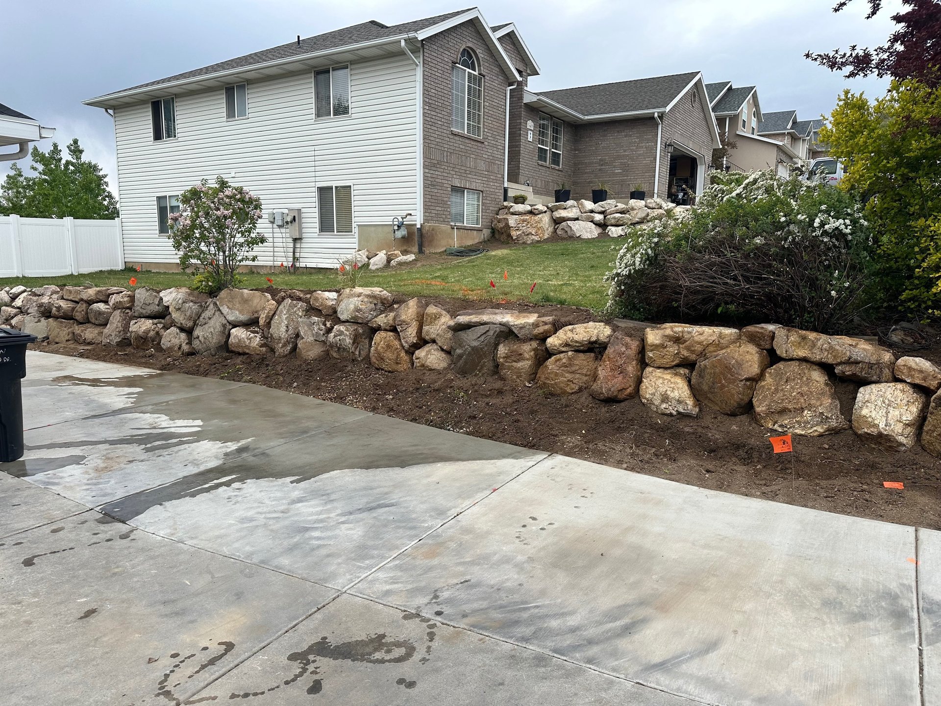 boulder retaining wall completed by JMB Earthworks