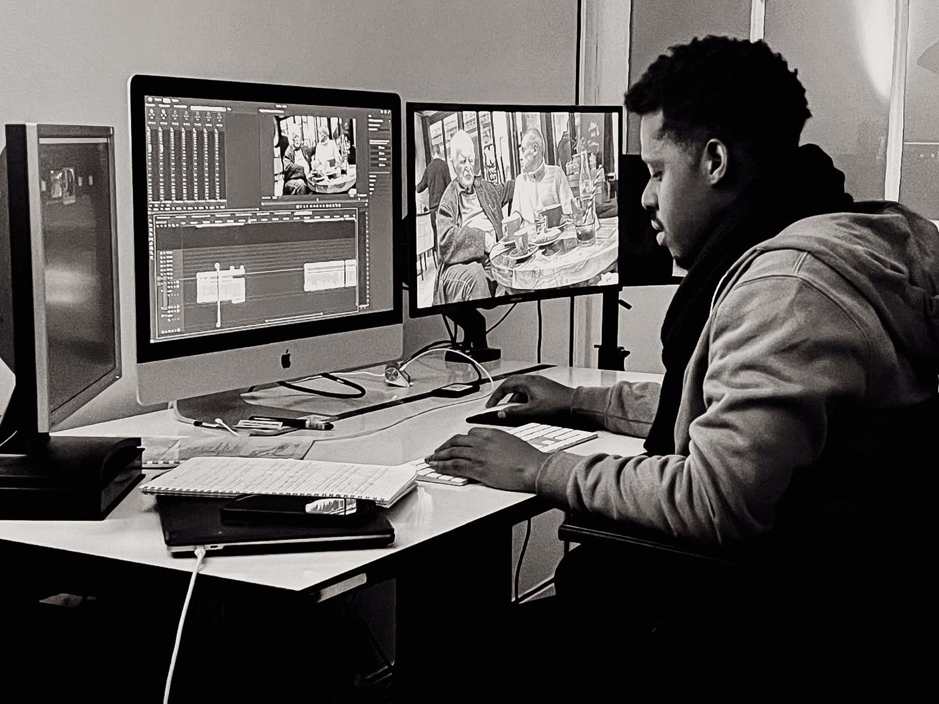 a man standing next to a woman holding a camera