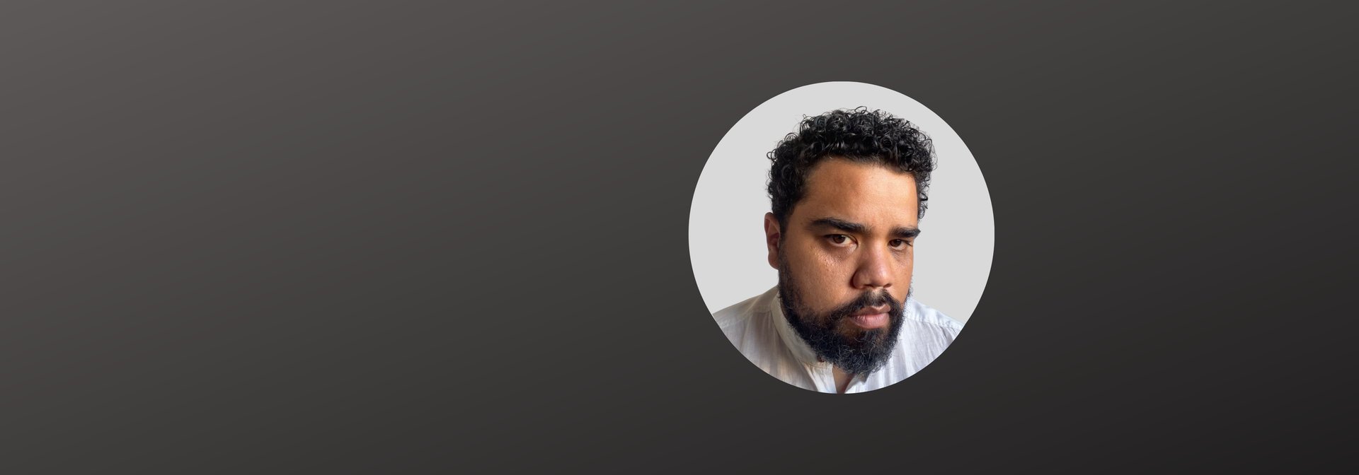 an abstract photo of a curved building with a blue sky in the background