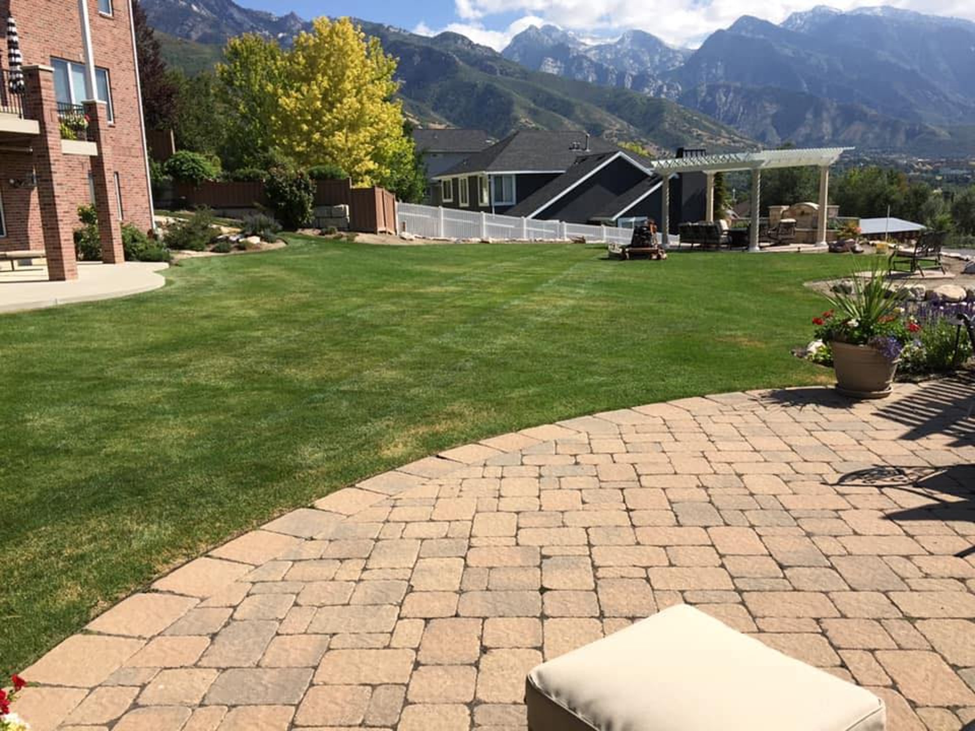 a courtyard with a fountain surrounded by trees