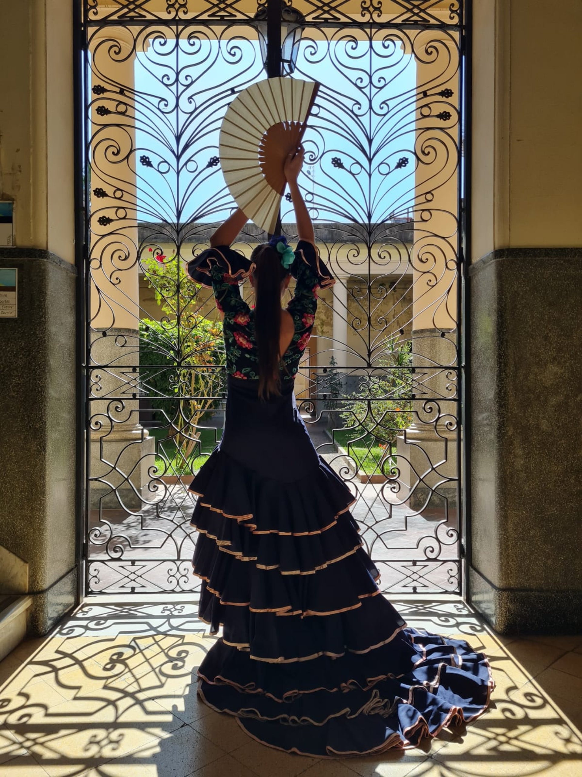 girl wearing gray dress dancing during daytime