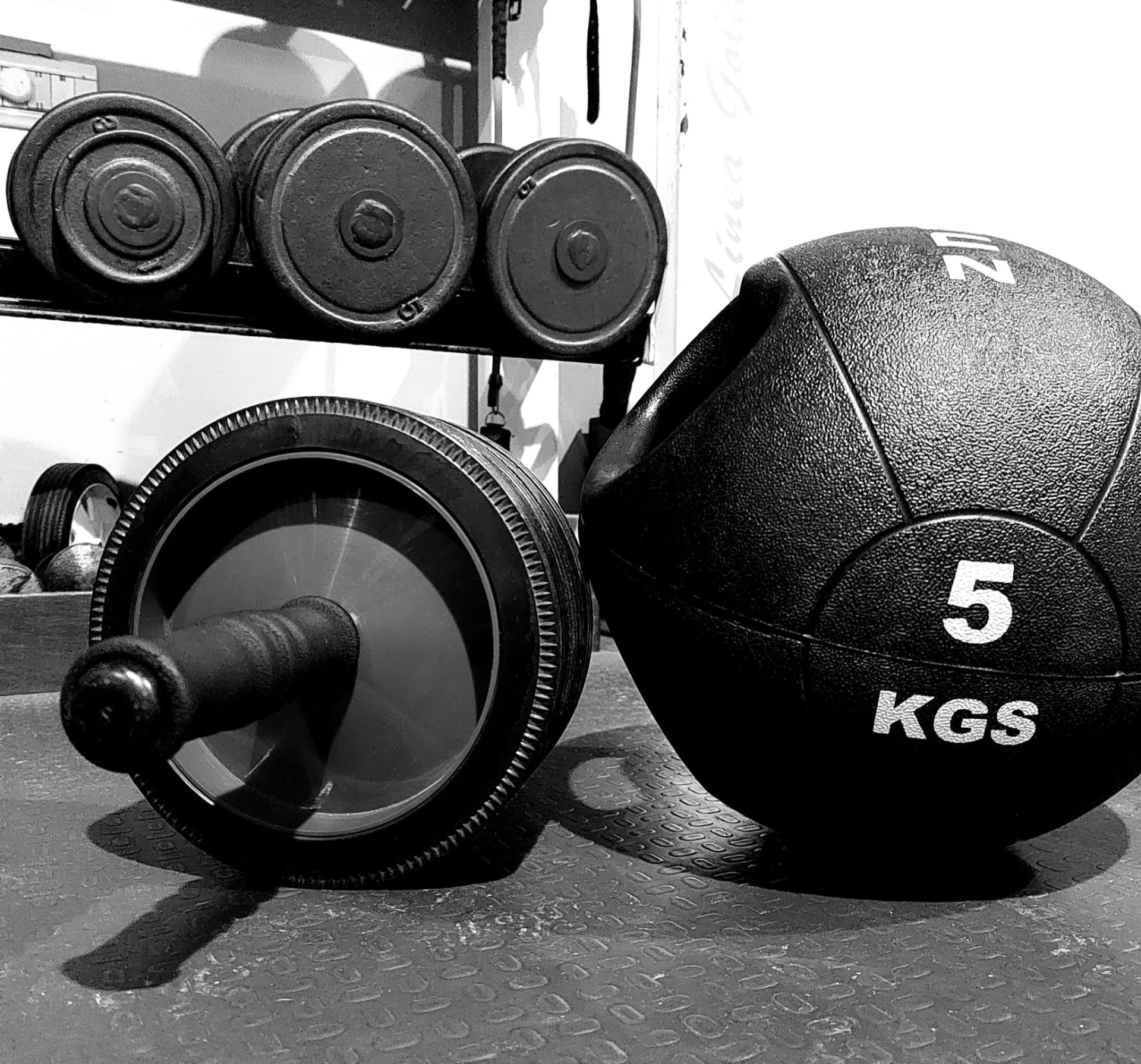 A couple of men working out in a gym