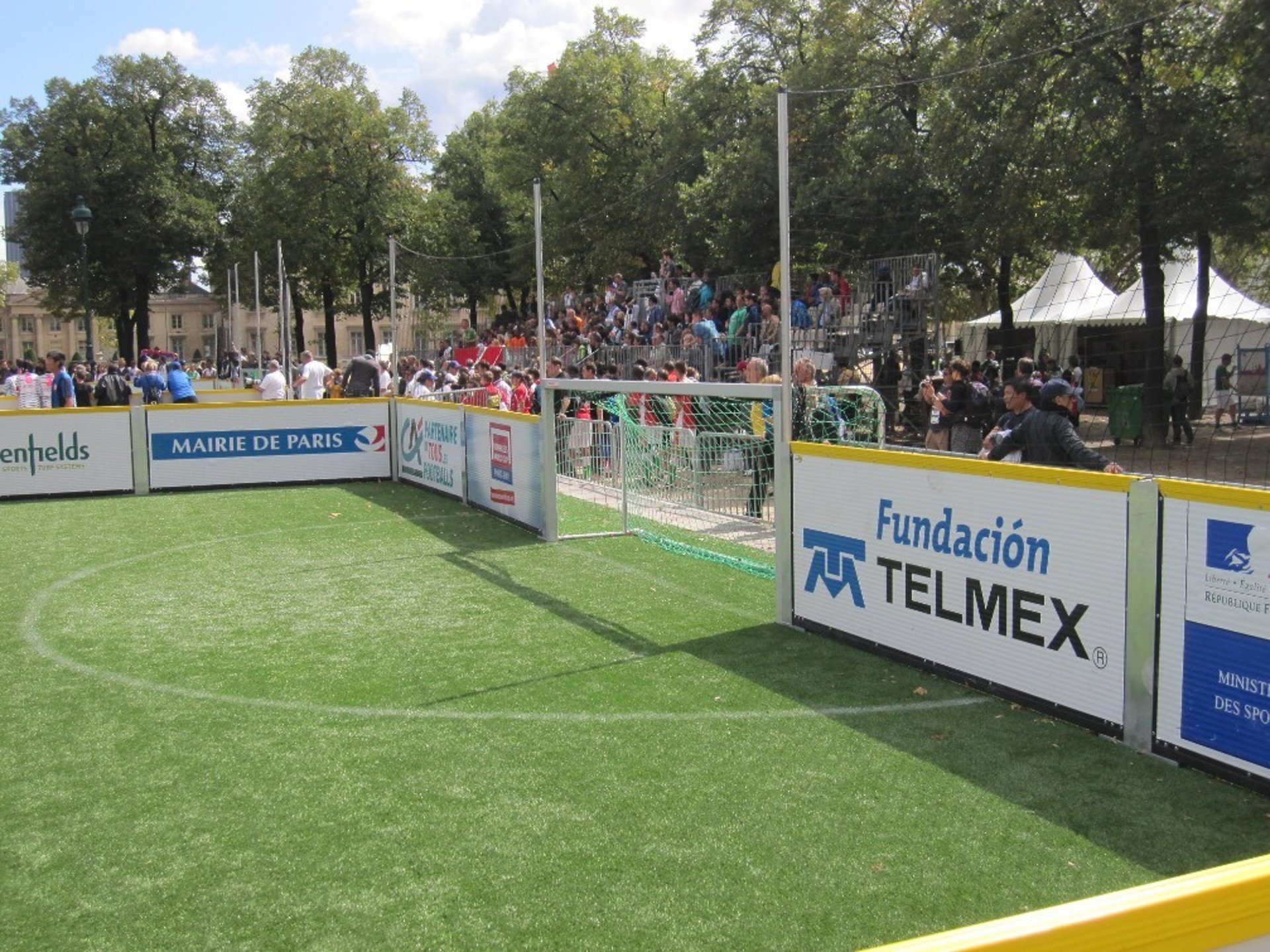 an abstract photo of a curved building with a blue sky in the background