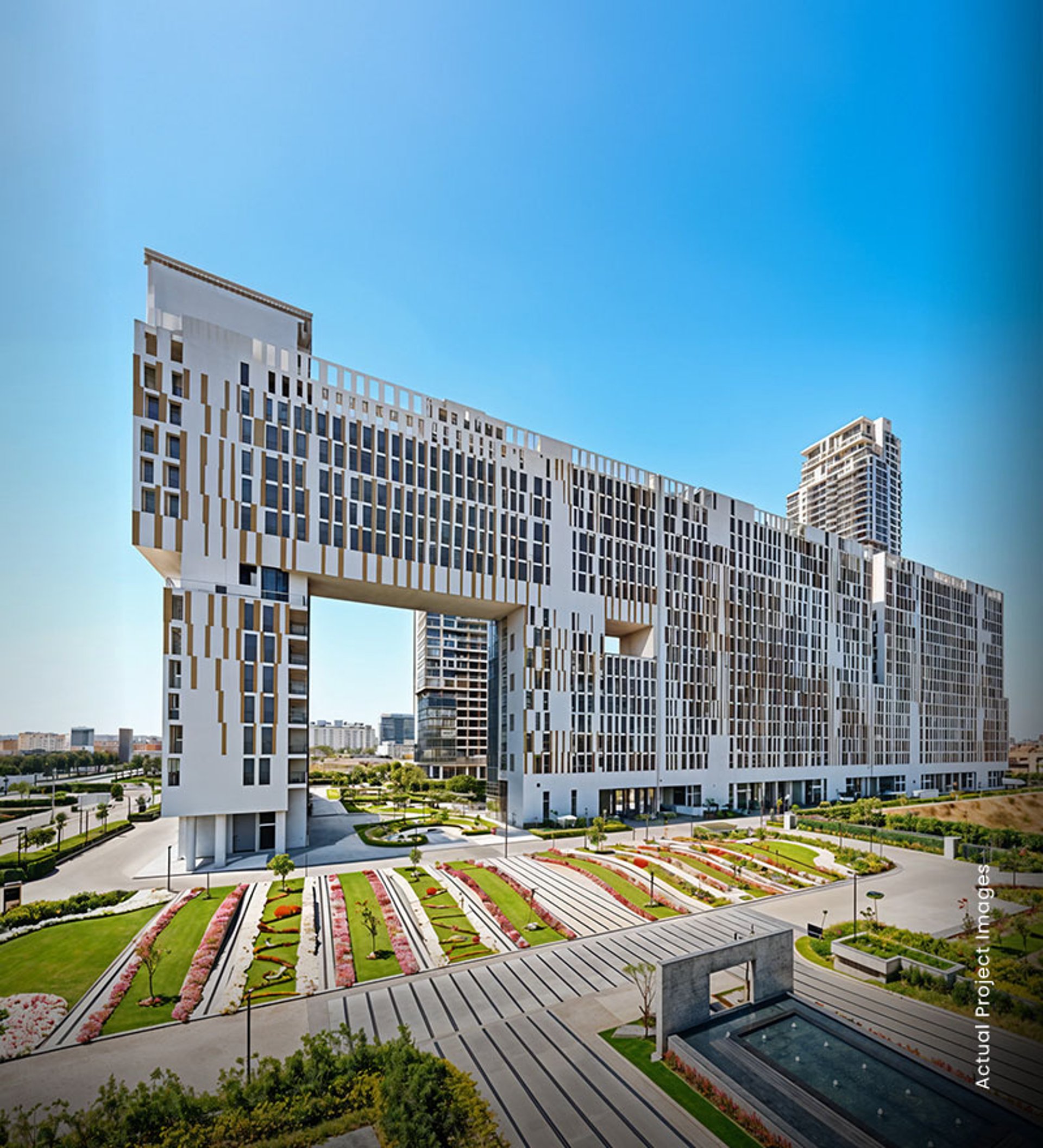 an abstract photo of a curved building with a blue sky in the background