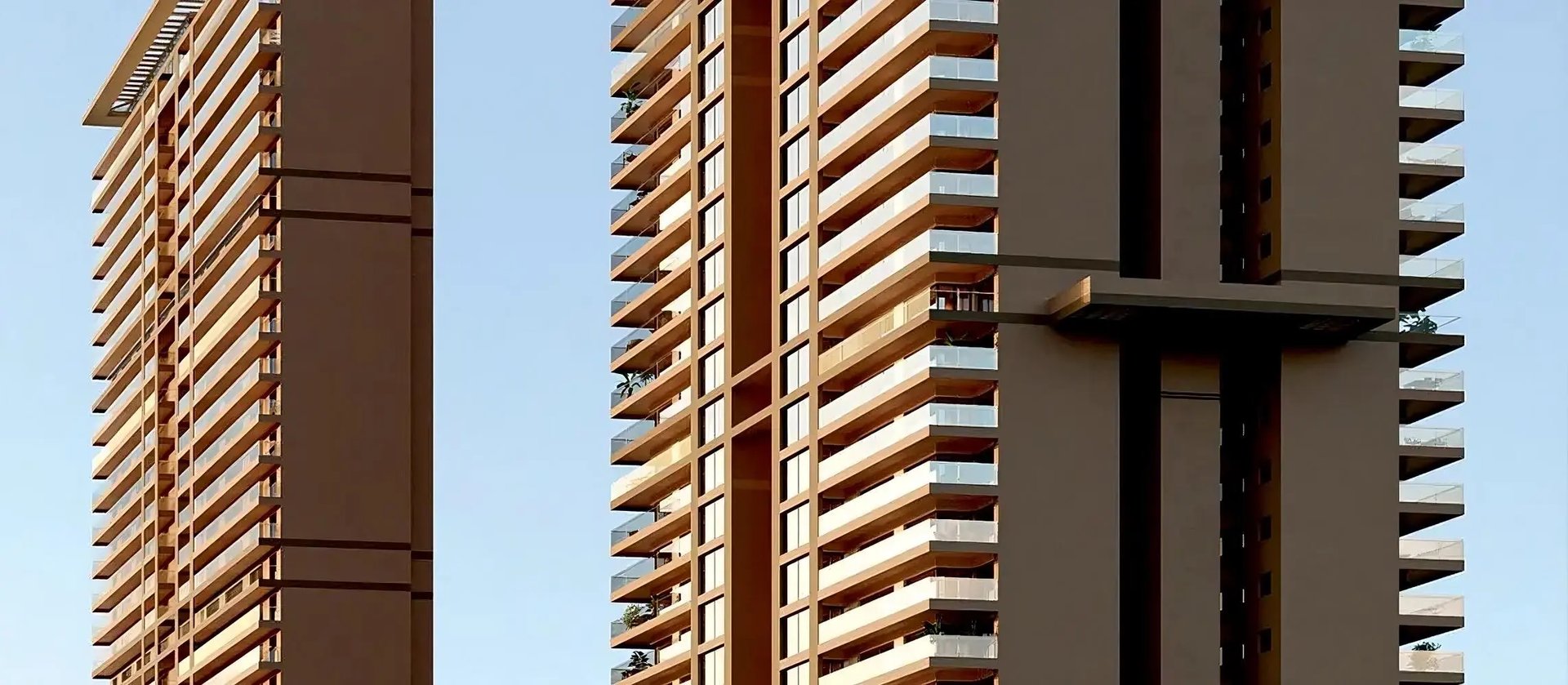 an abstract photo of a curved building with a blue sky in the background
