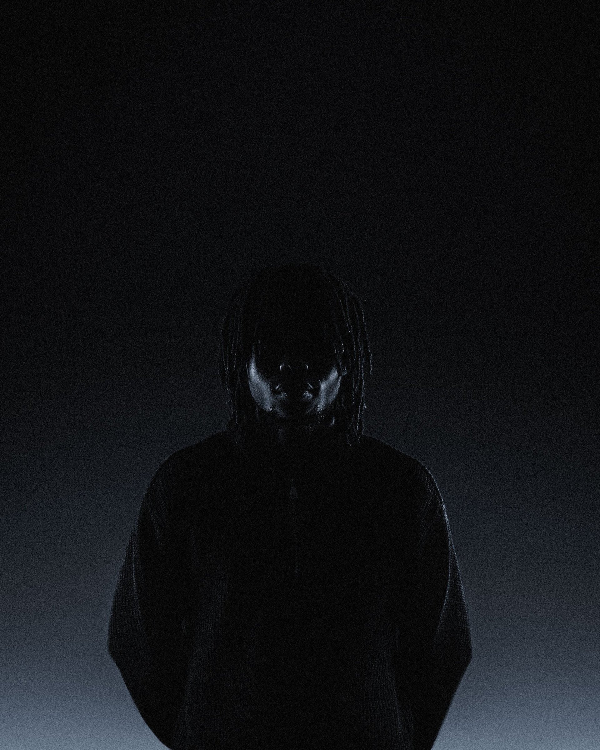an abstract photo of a curved building with a blue sky in the background