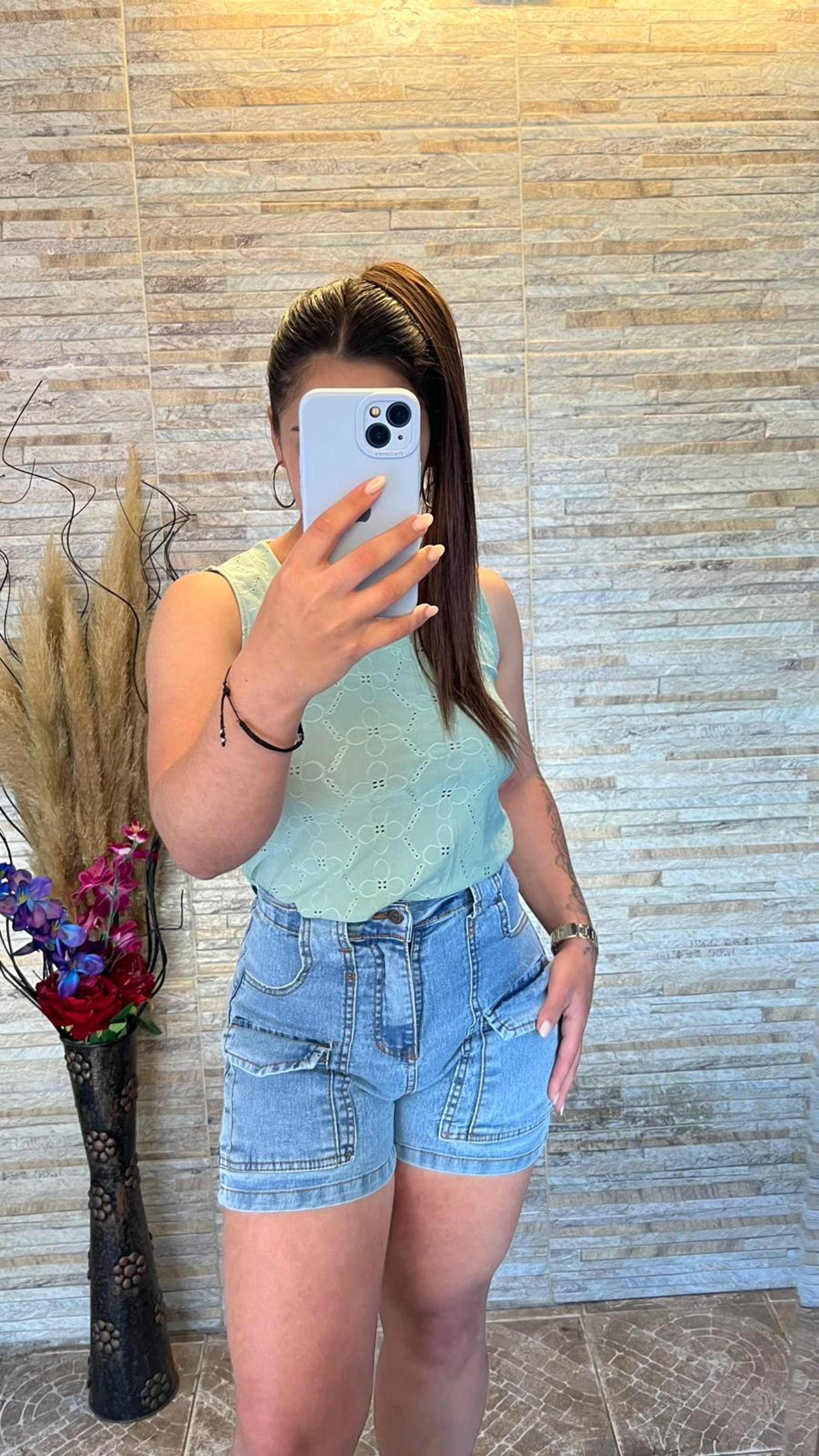 person wearing grey knit sweater