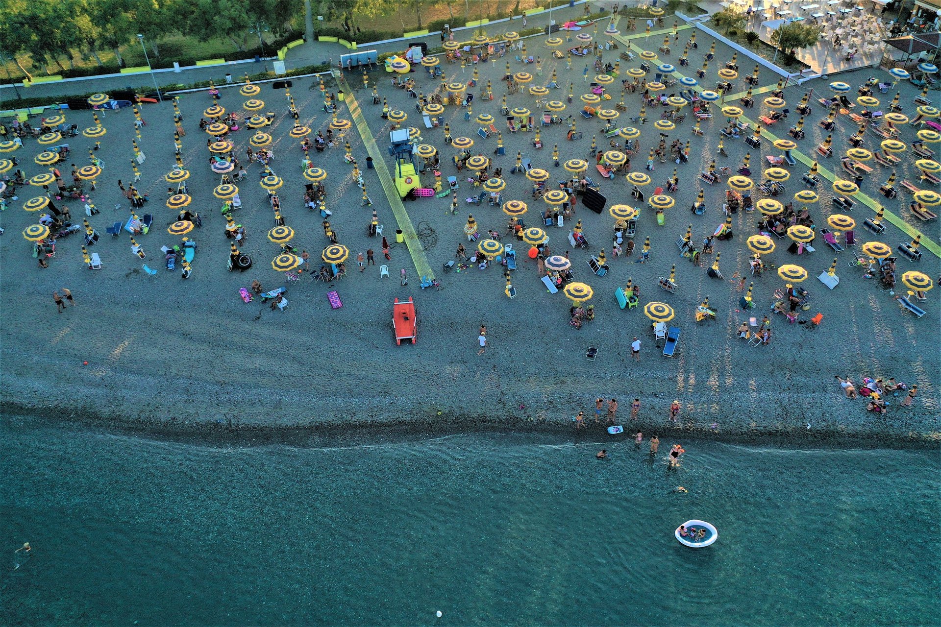woman wearing yellow long-sleeved dress under white clouds and blue sky during daytime
