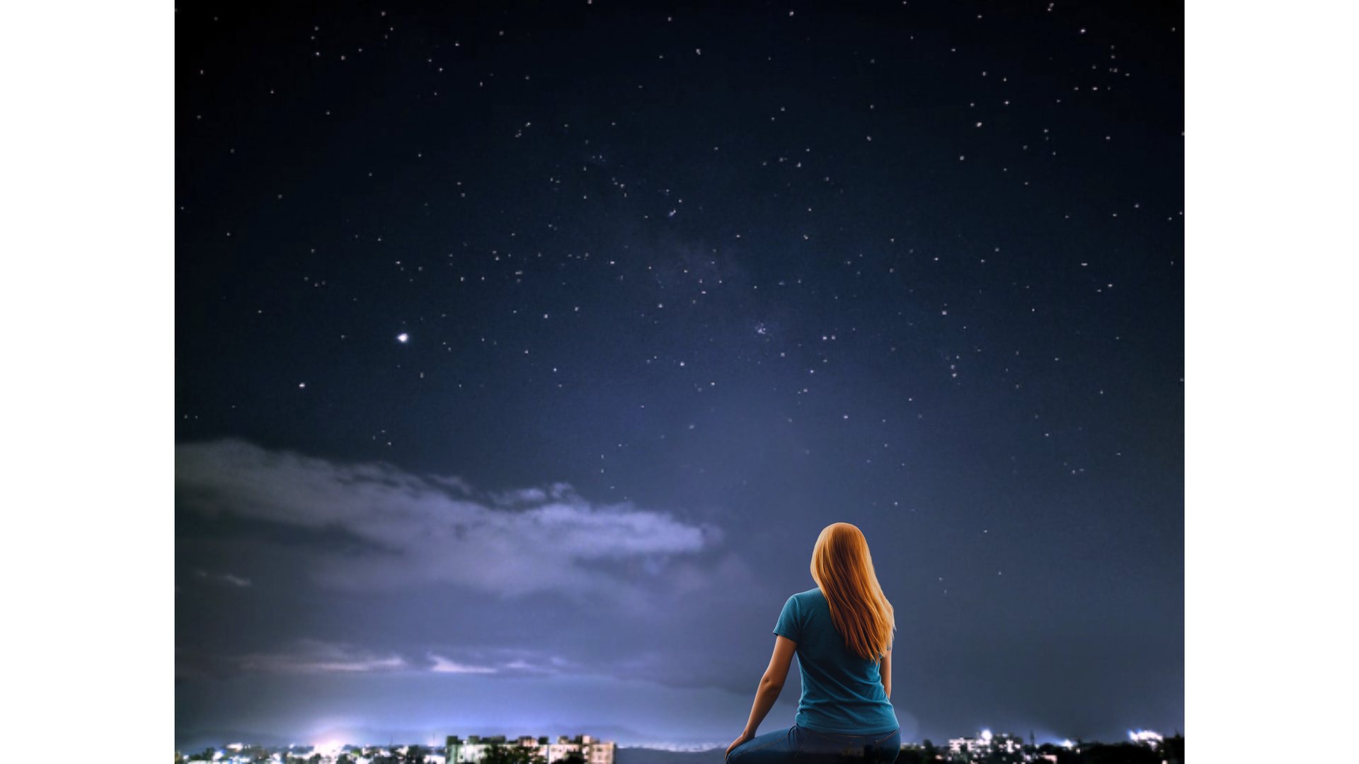 man in white t-shirt standing on field during night time