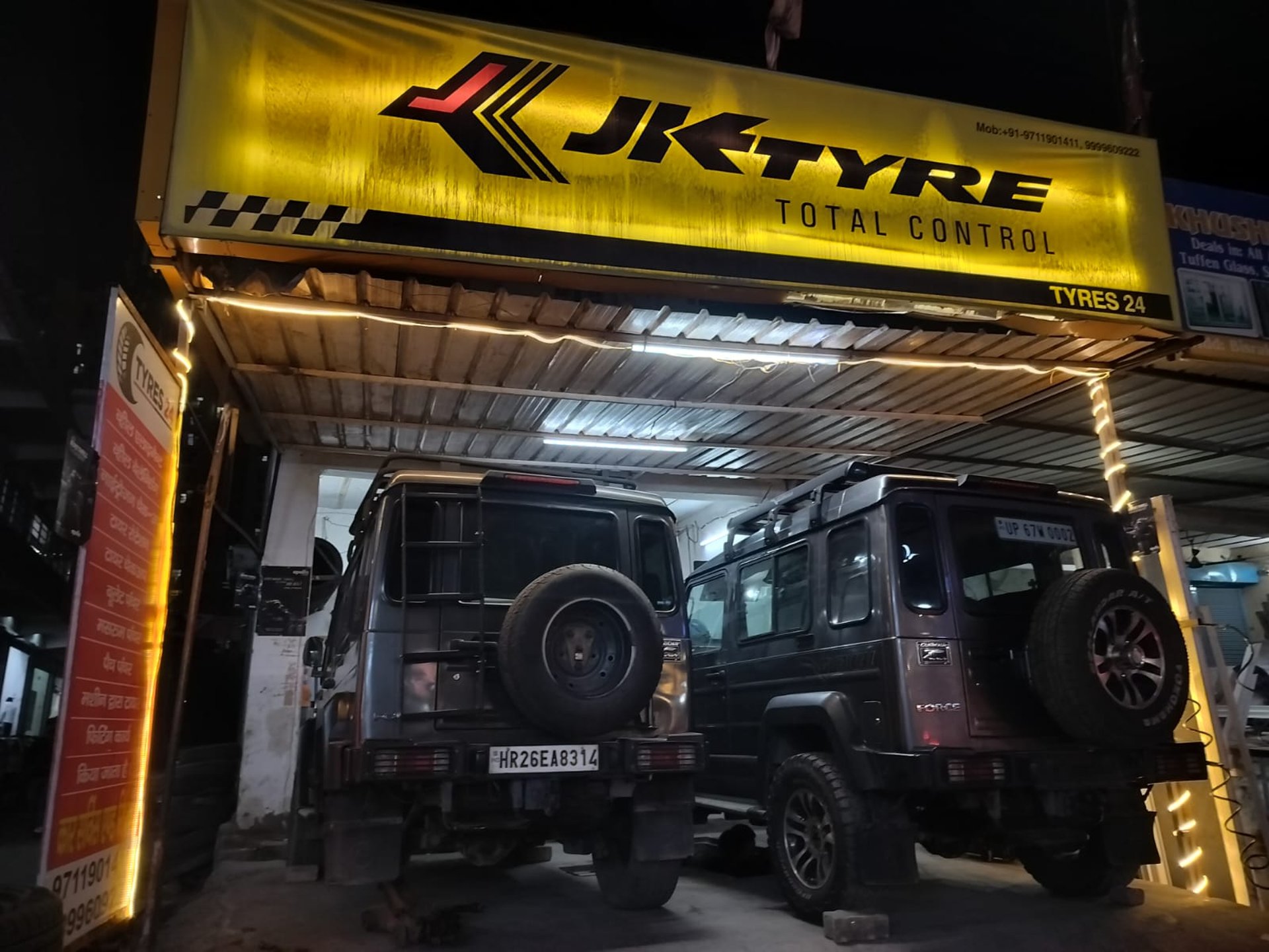 man welding a black metal