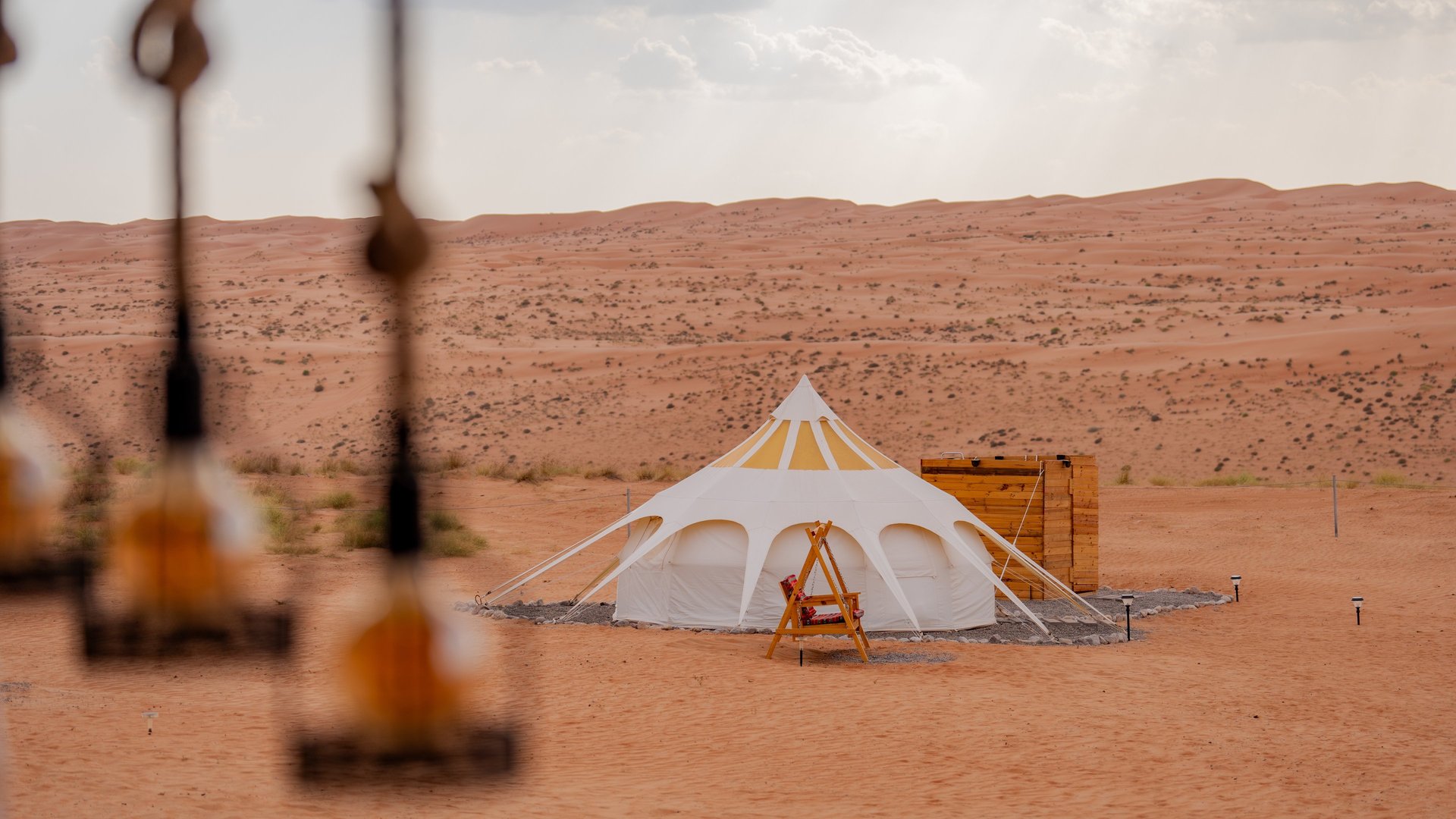 an abstract photo of a curved building with a blue sky in the background