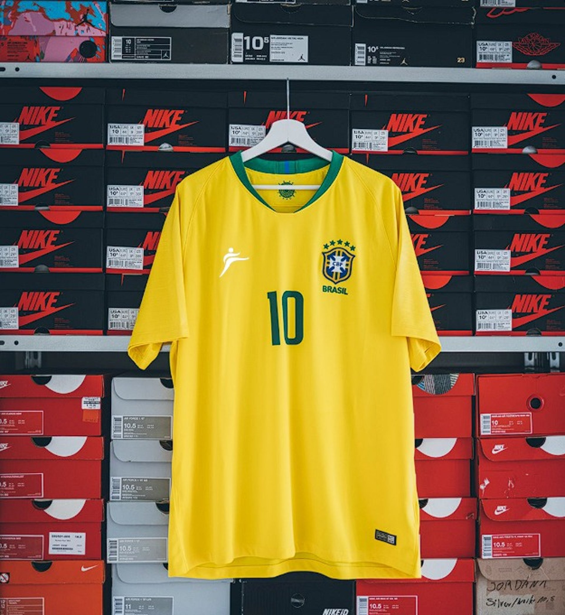 hanging yellow and green Nike soccer jersey shirt
