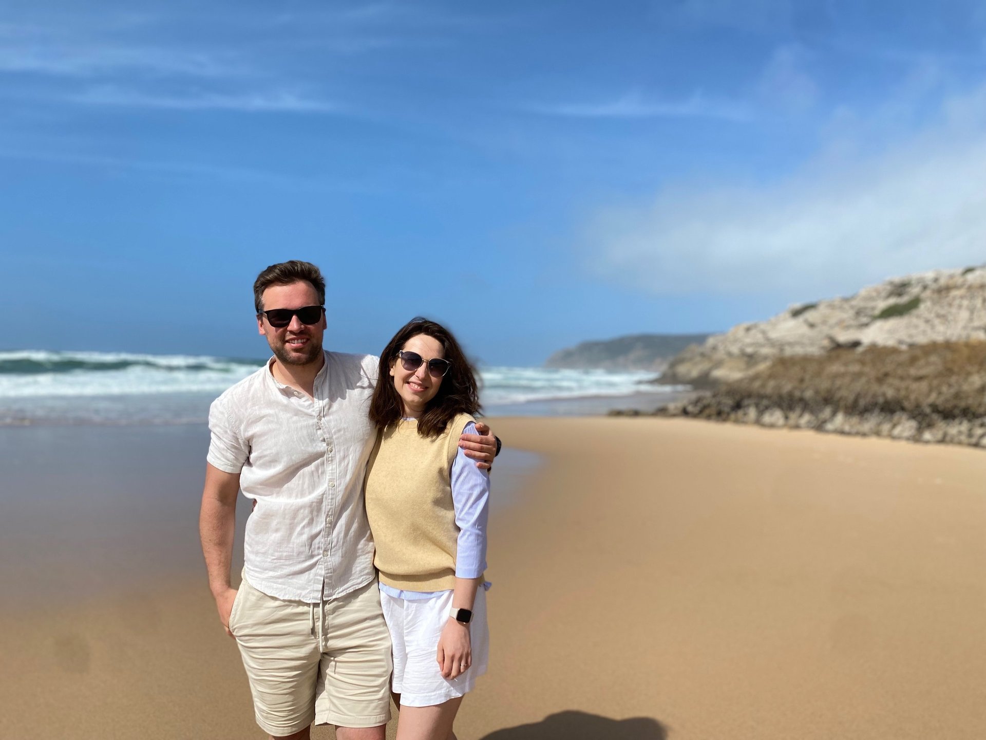 A pier on the water with people walking on it