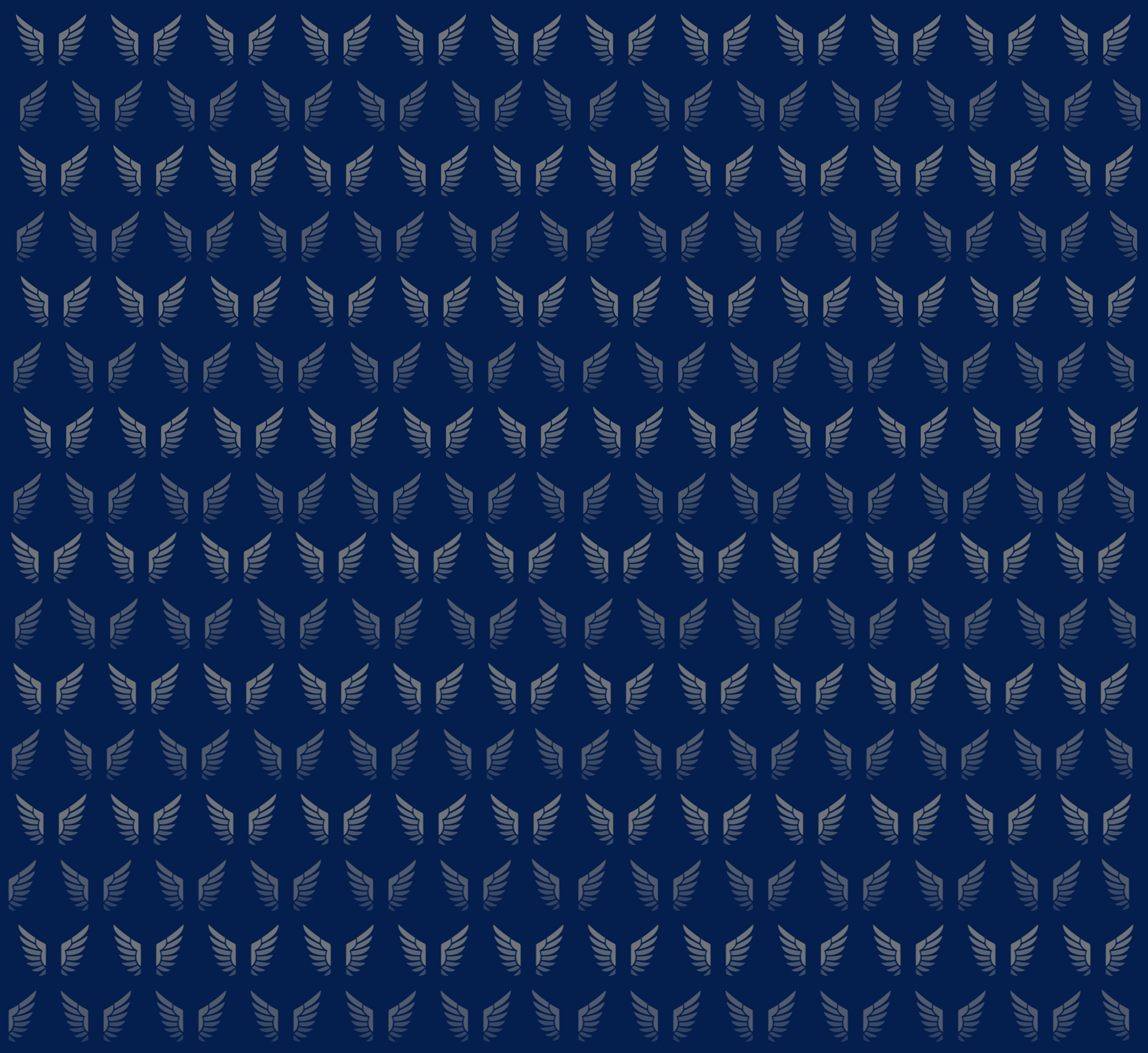 a desk with a notebook, pens, and a box of cards