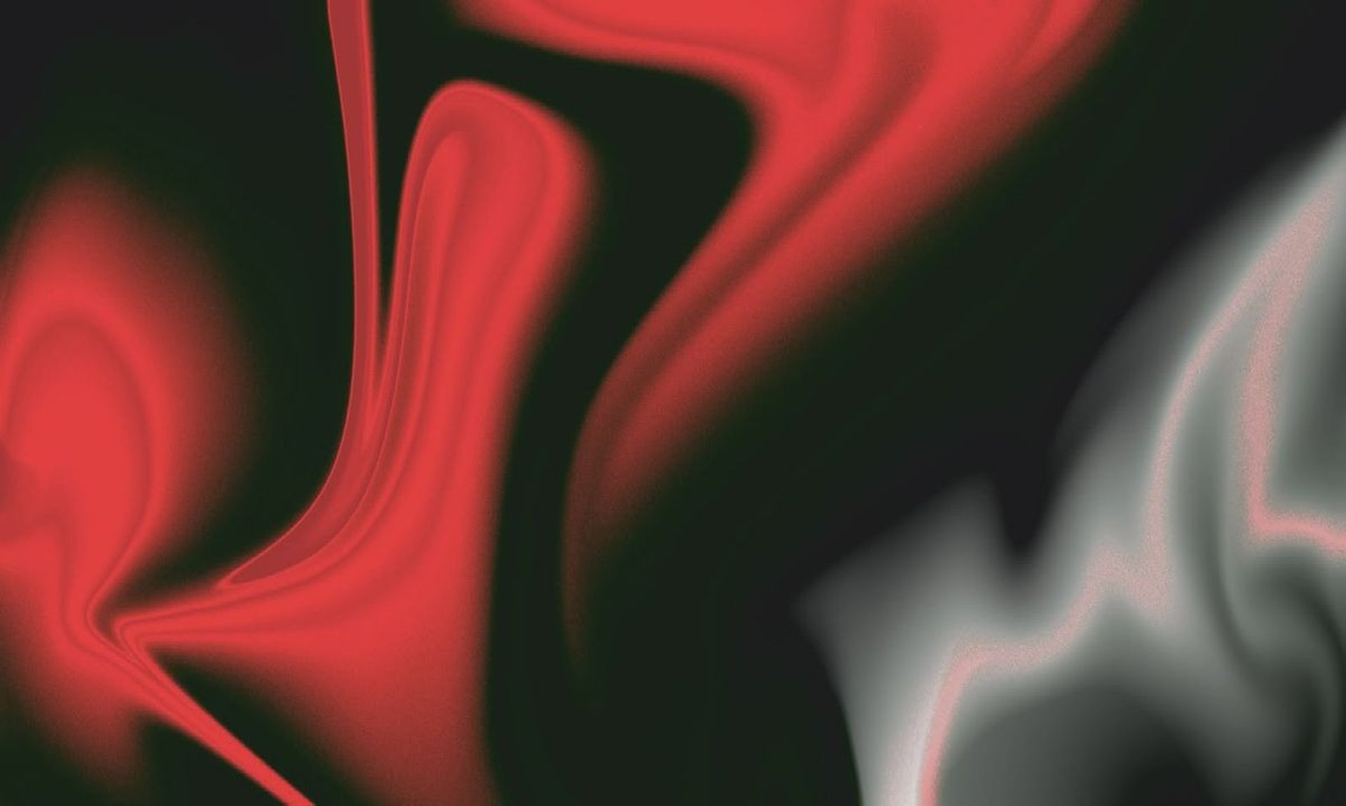 Abstract dark shape against a red and orange gradient