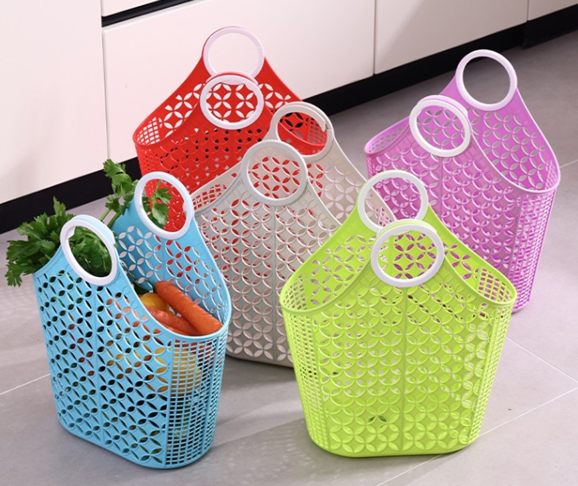 a hat and a bottle on a towel on the beach