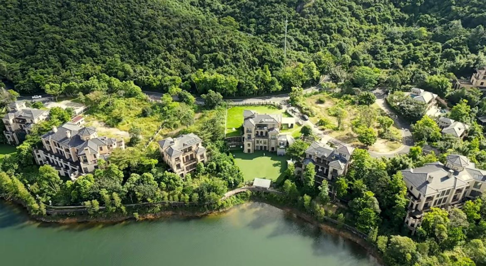gold wedding band on white textile