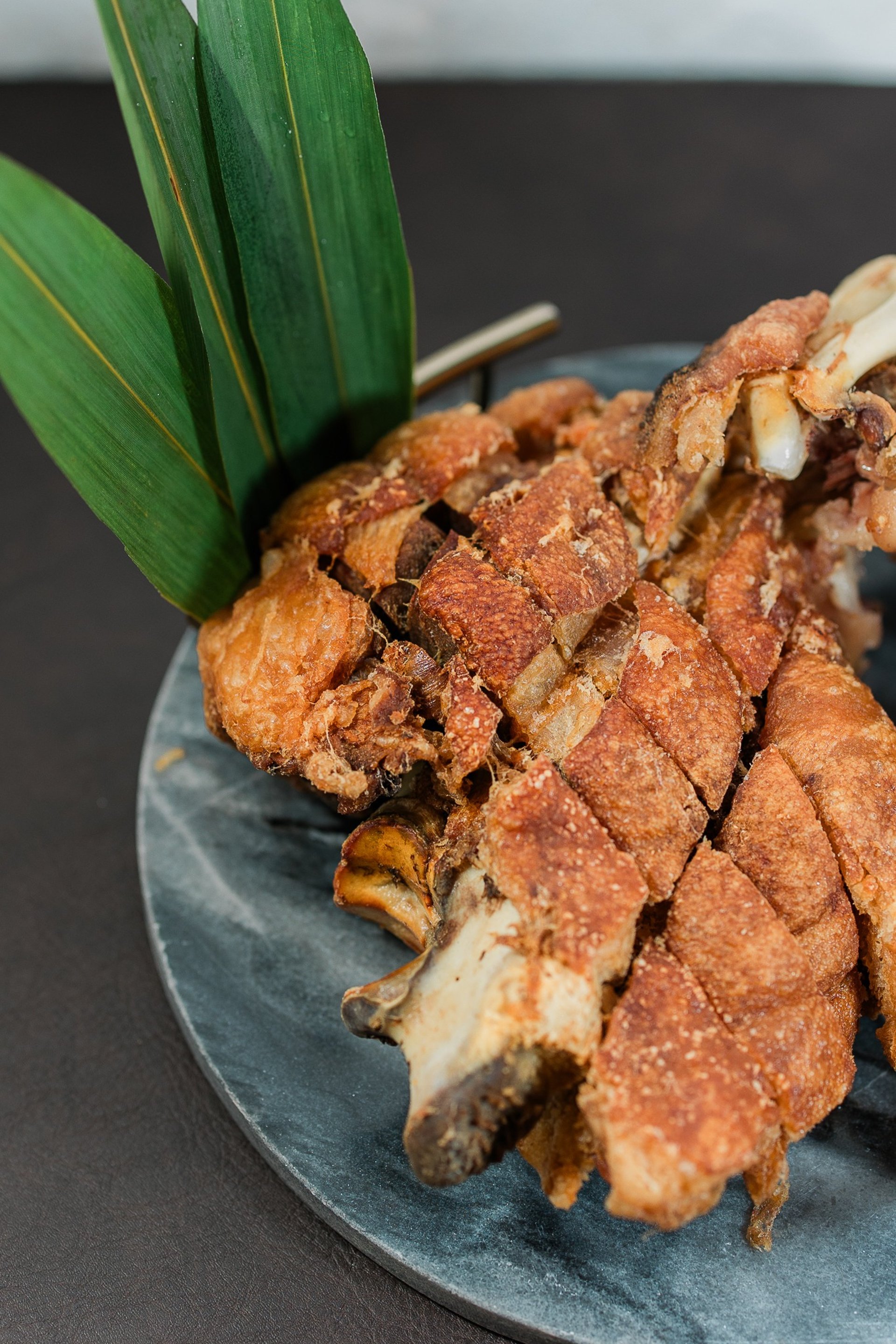 an abstract photo of a curved building with a blue sky in the background