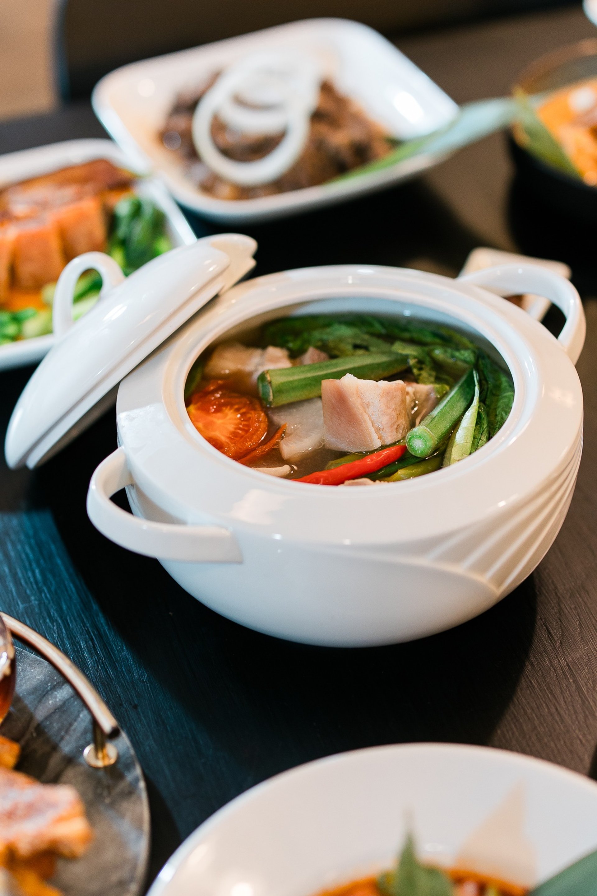 an abstract photo of a curved building with a blue sky in the background