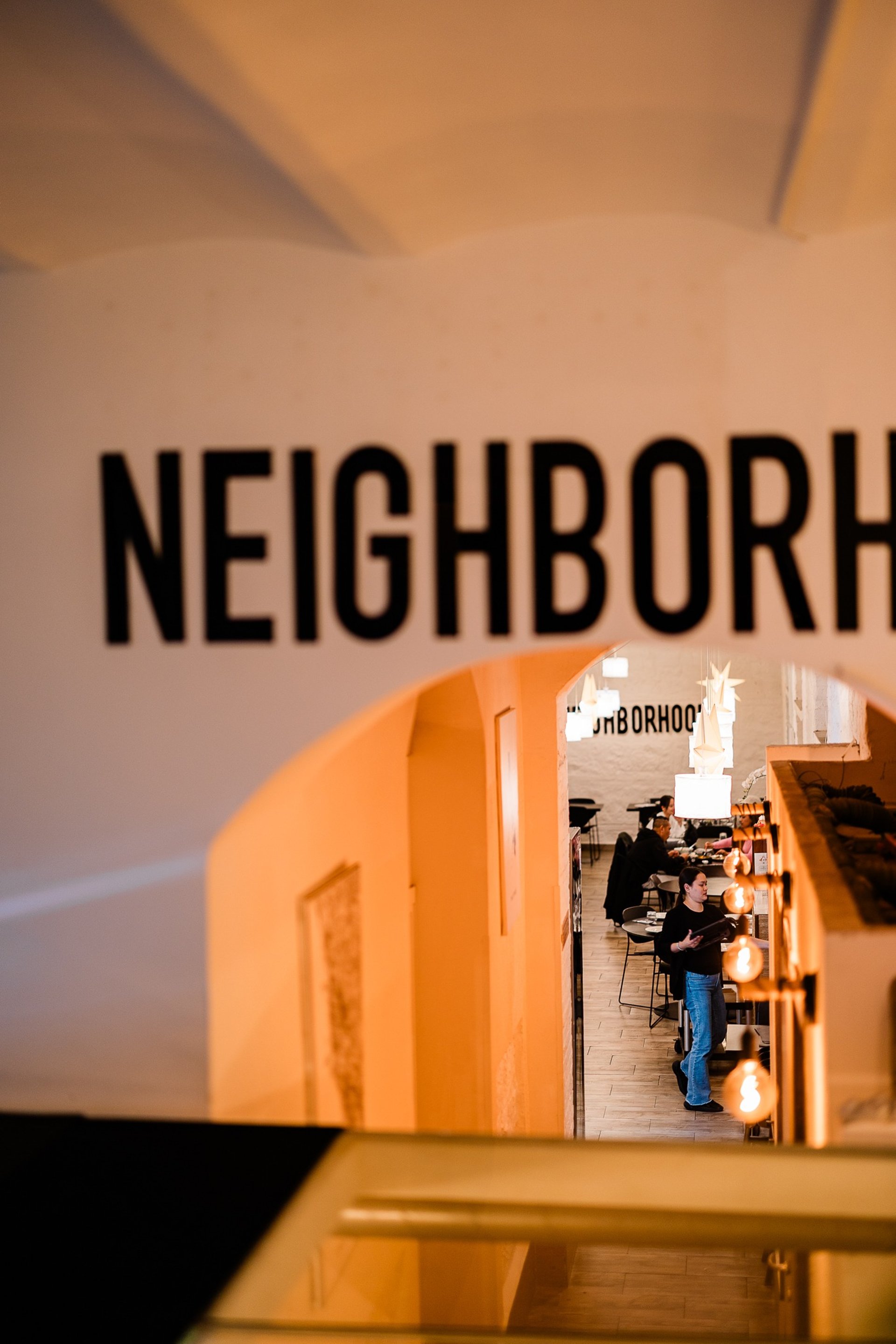 an abstract photo of a curved building with a blue sky in the background