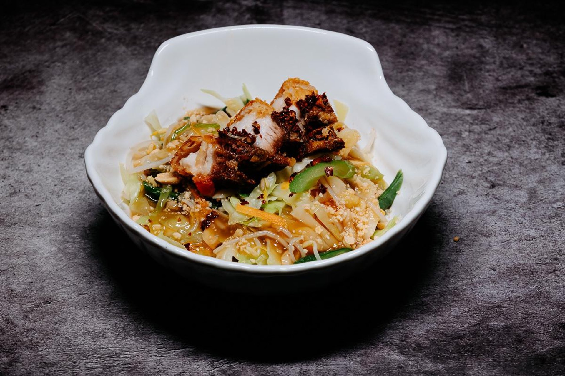 an abstract photo of a curved building with a blue sky in the background