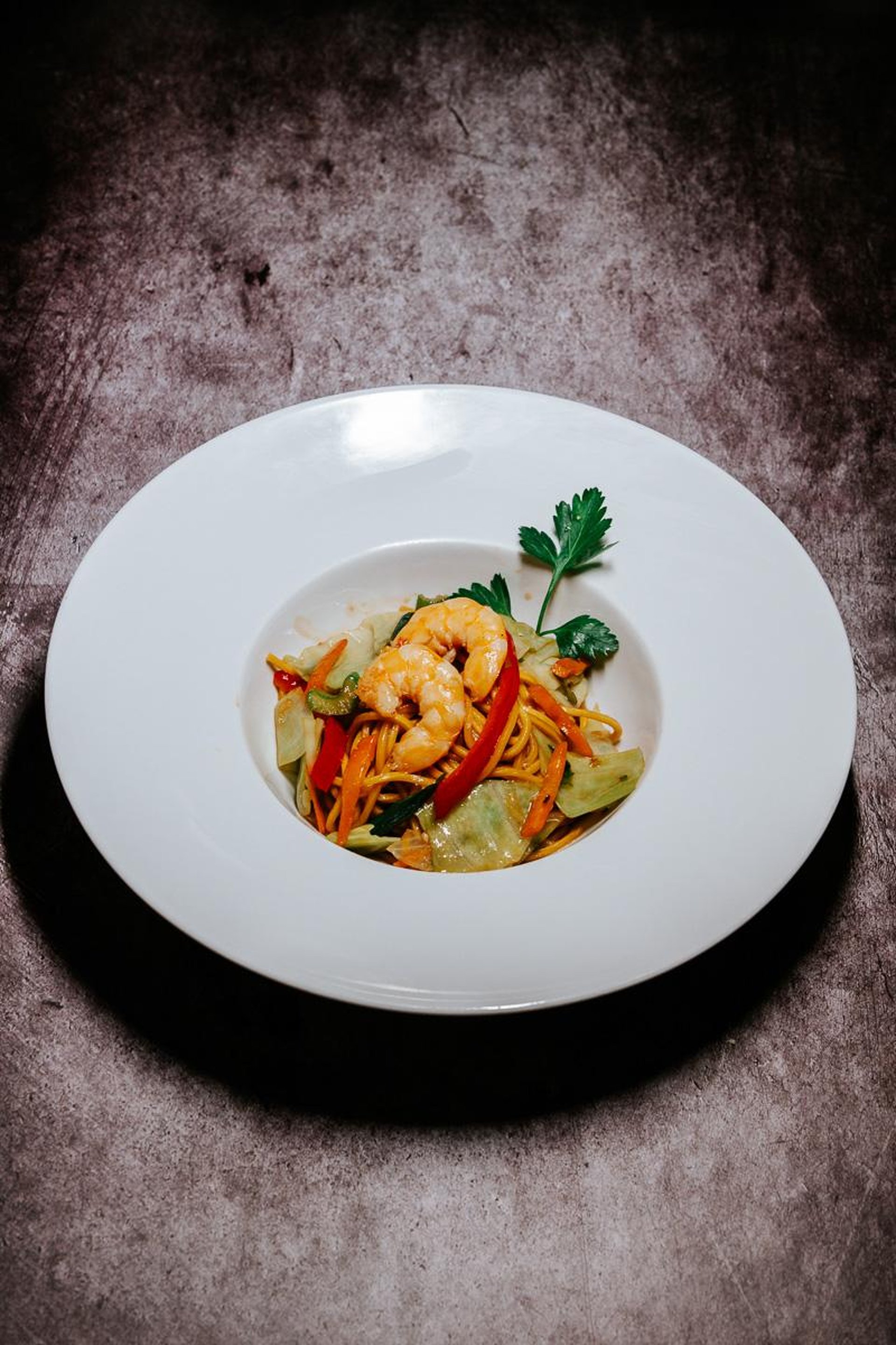 an abstract photo of a curved building with a blue sky in the background