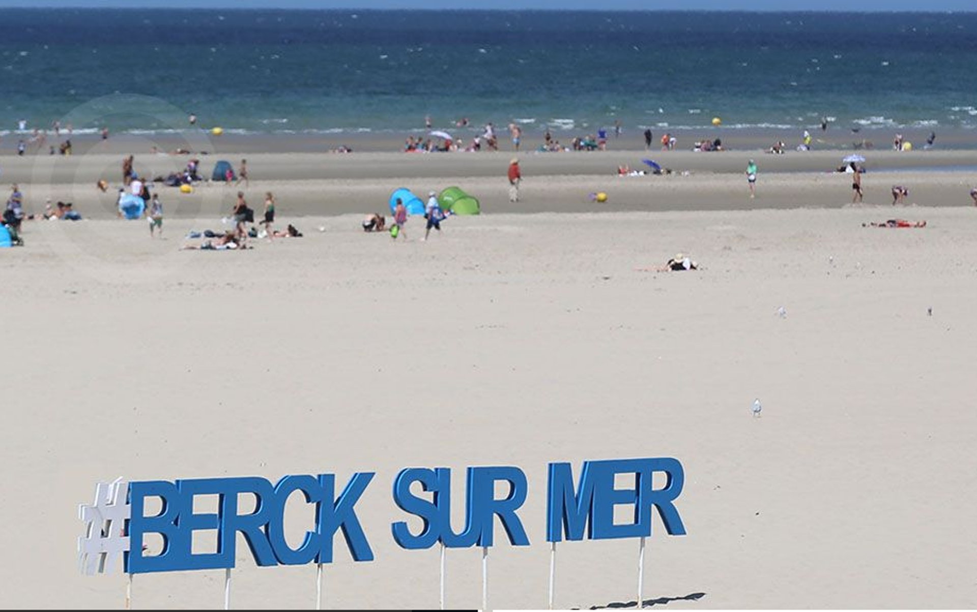 woman wearing yellow long-sleeved dress under white clouds and blue sky during daytime