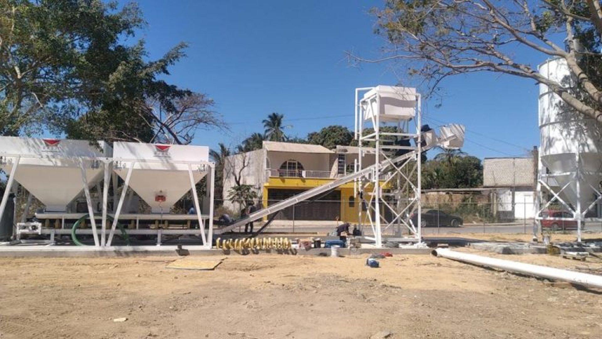 woman wearing yellow long-sleeved dress under white clouds and blue sky during daytime