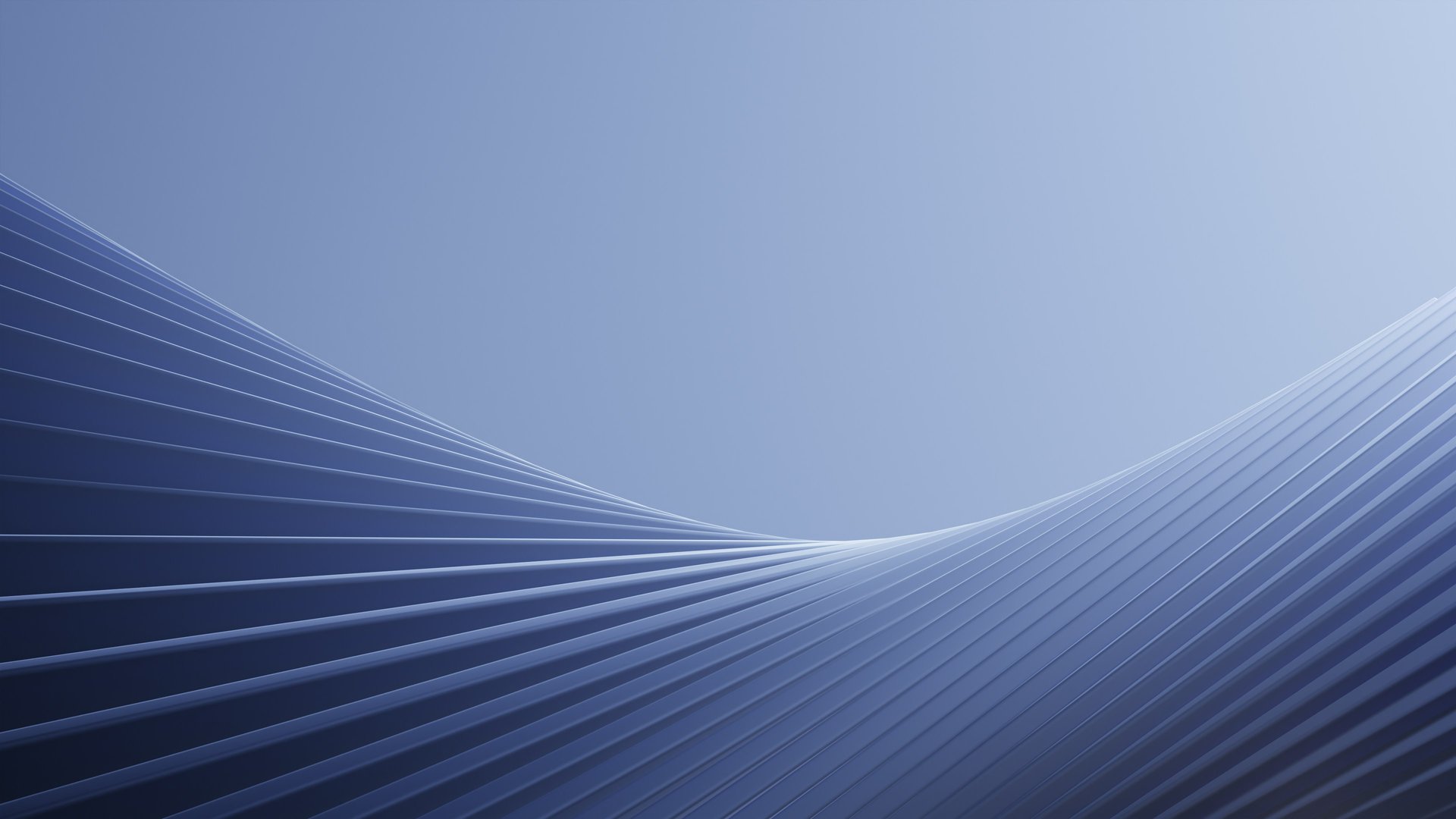 an abstract photo of a curved building with a blue sky in the background