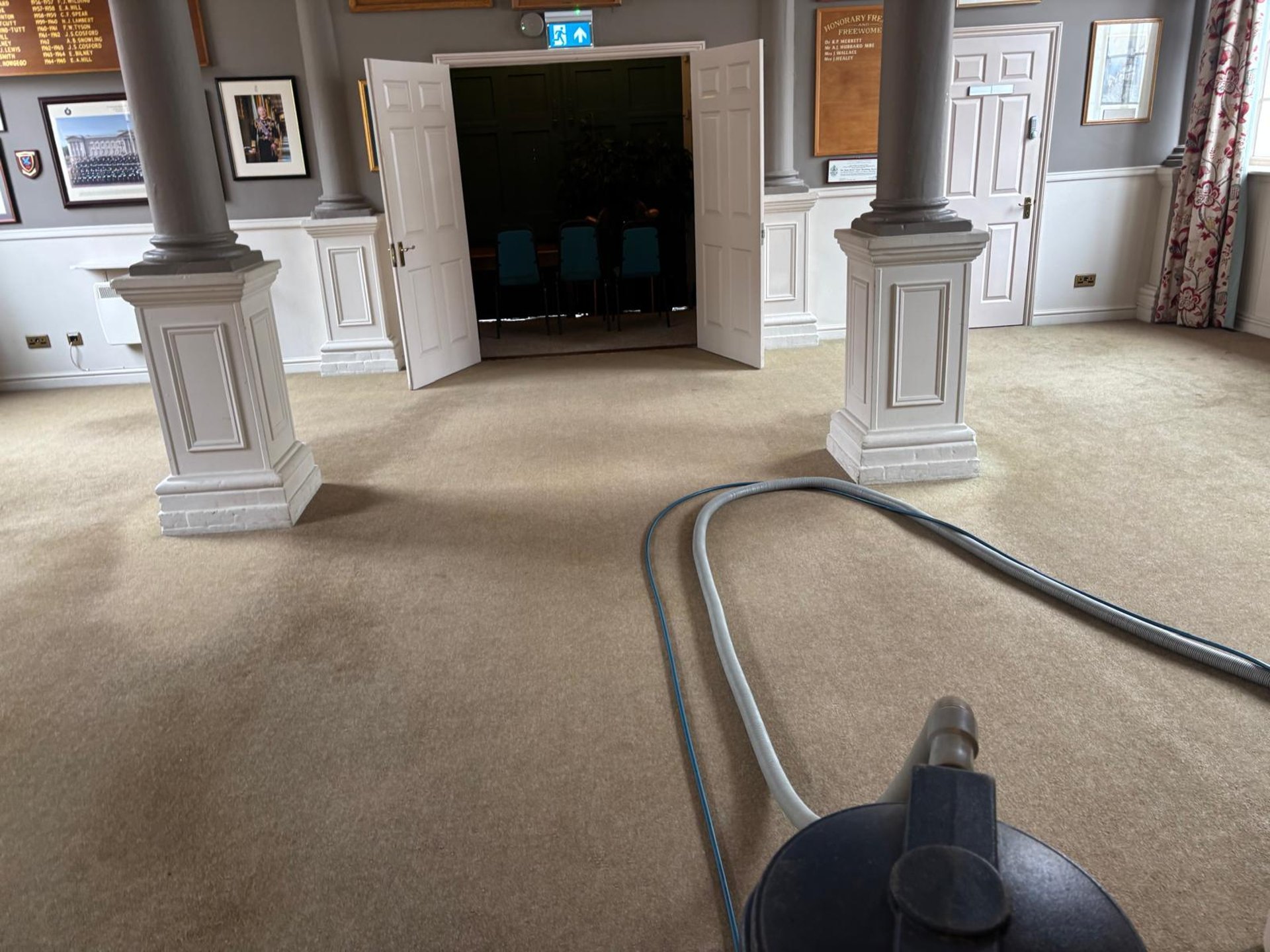 an abstract photo of a curved building with a blue sky in the background