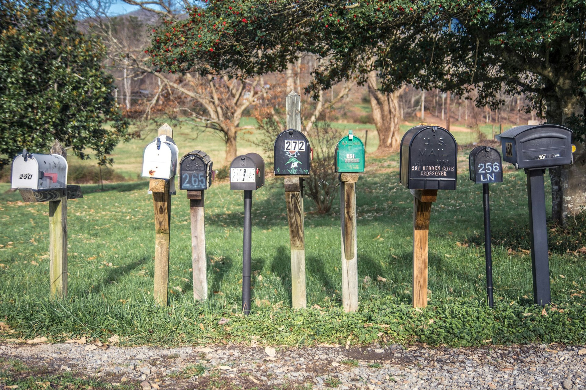 six assorted-color mail boxes