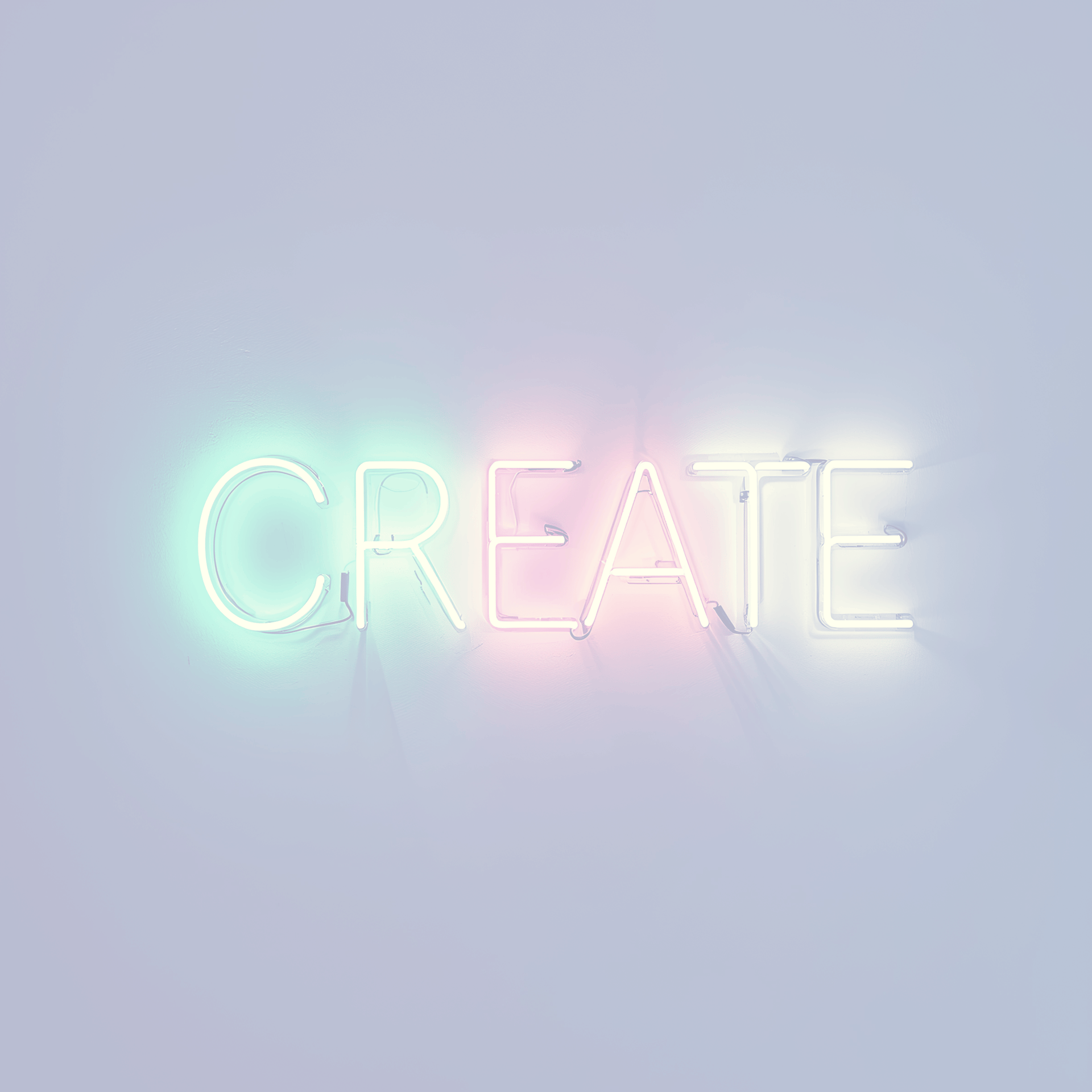 the word create is lit up in the dark