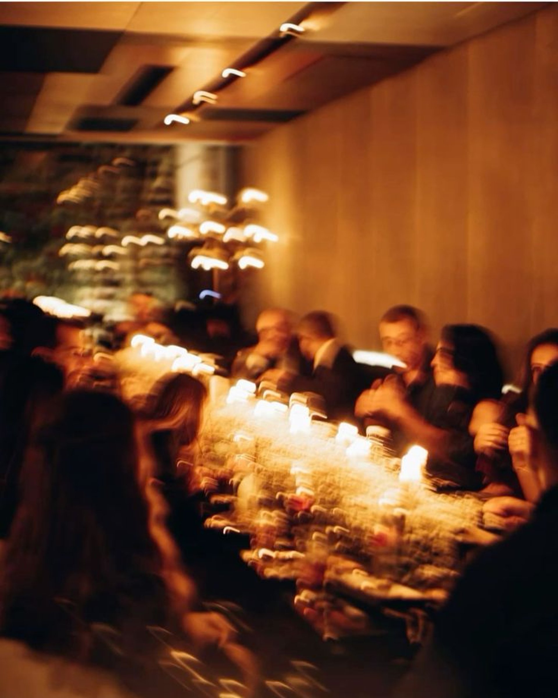 an abstract photo of a curved building with a blue sky in the background
