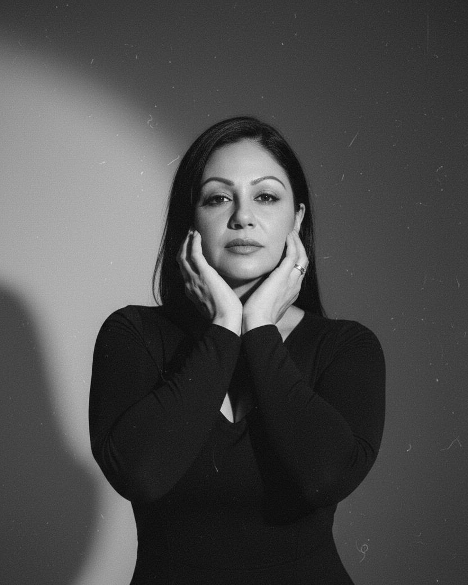 woman wearing yellow long-sleeved dress under white clouds and blue sky during daytime
