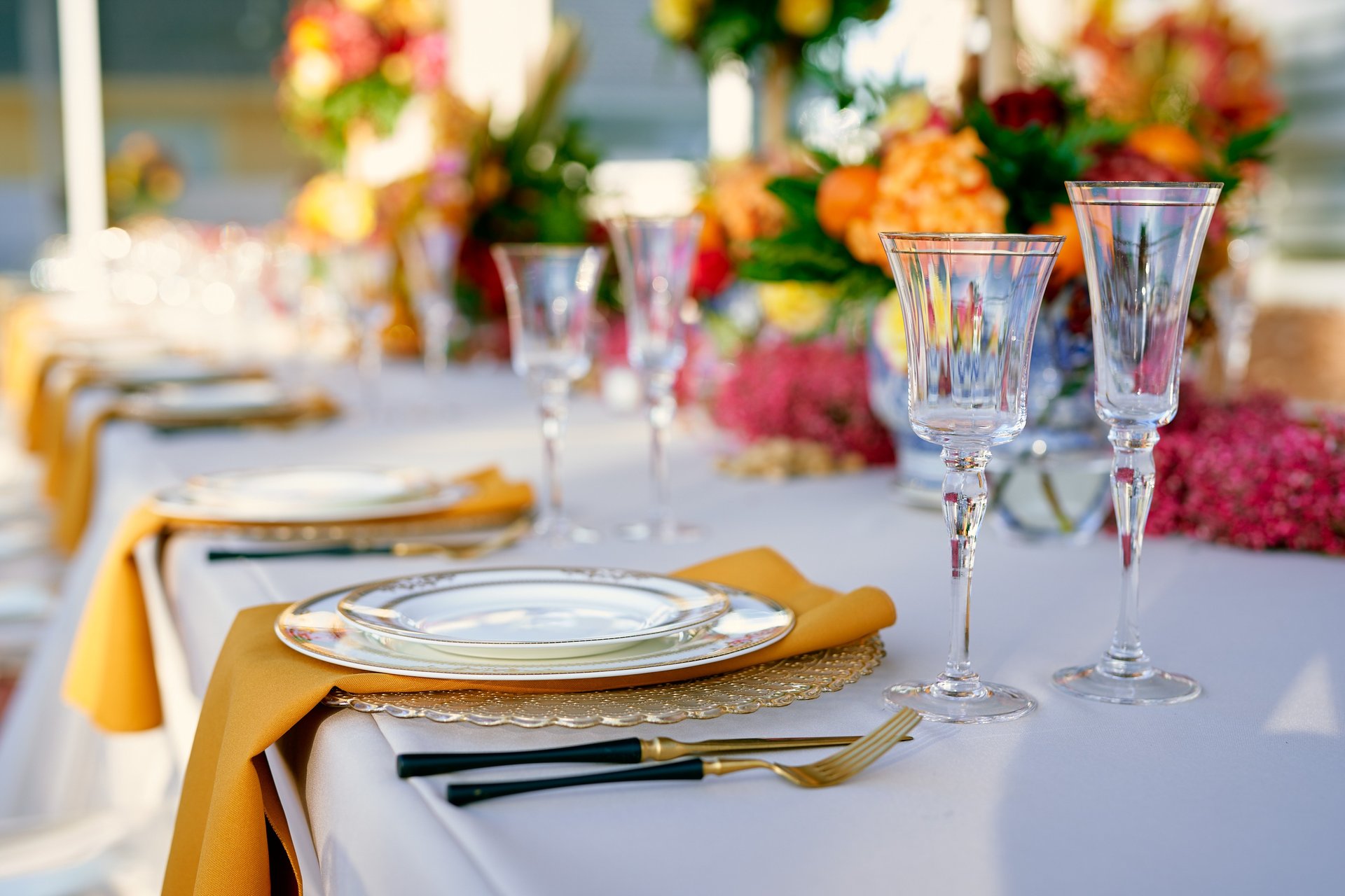 woman wearing yellow long-sleeved dress under white clouds and blue sky during daytime