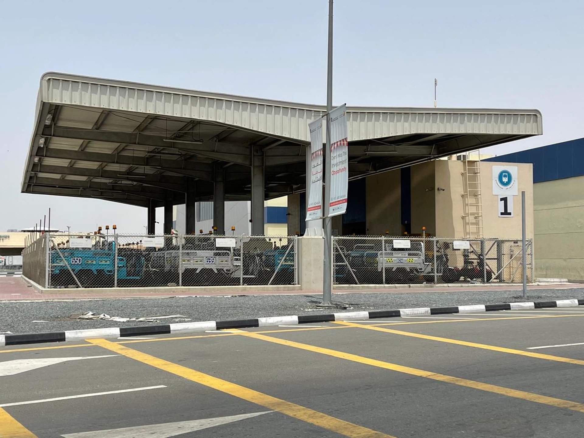 an abstract photo of a curved building with a blue sky in the background