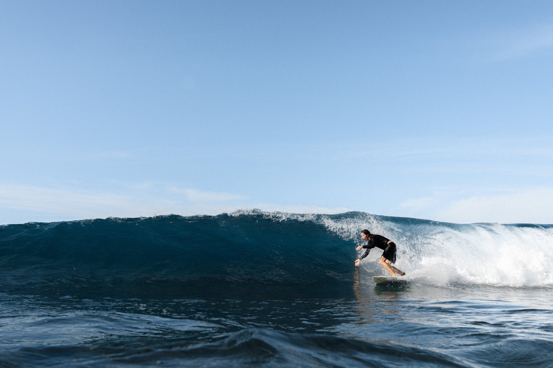 green and brown island in the middle of blue water