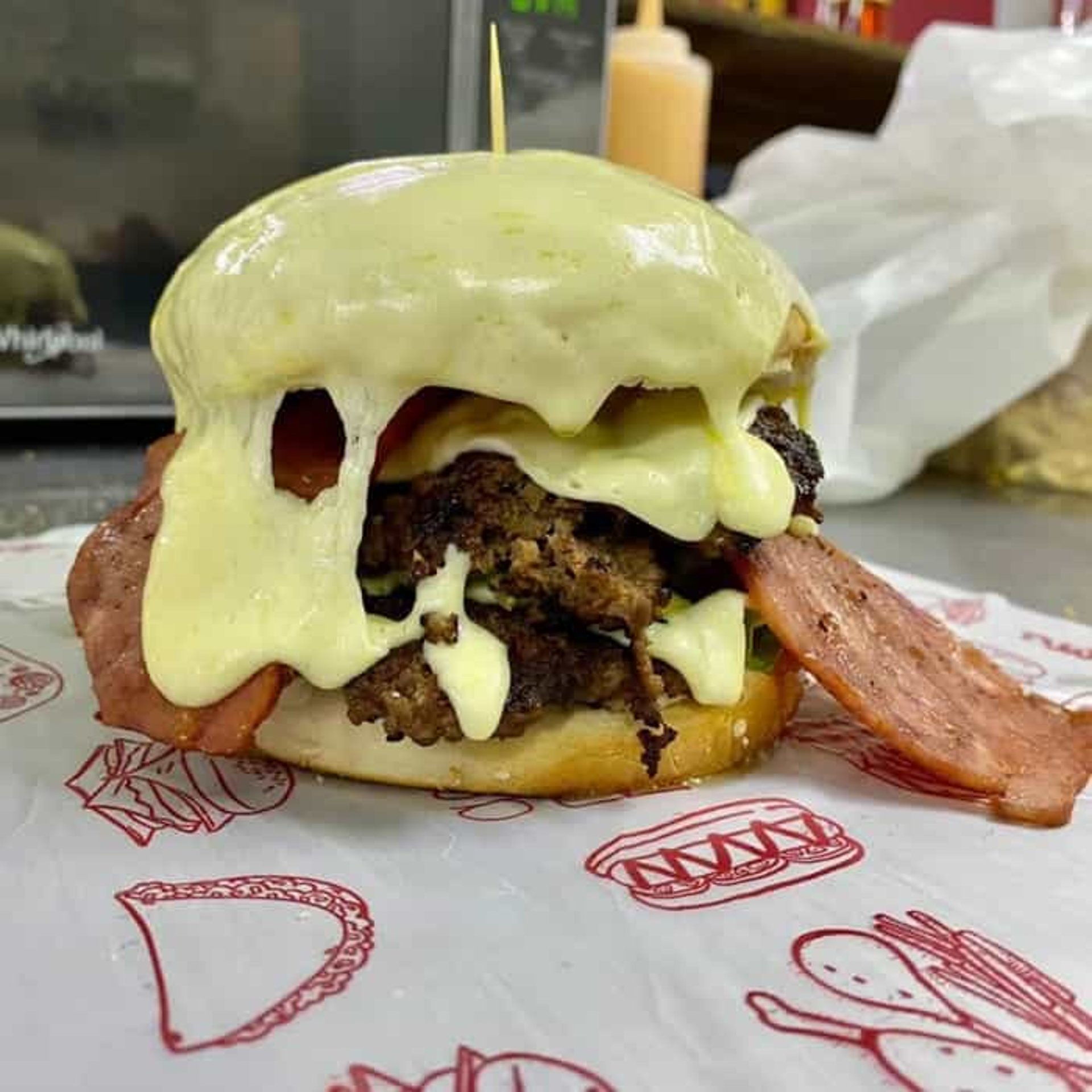 hamburger by french fries on board