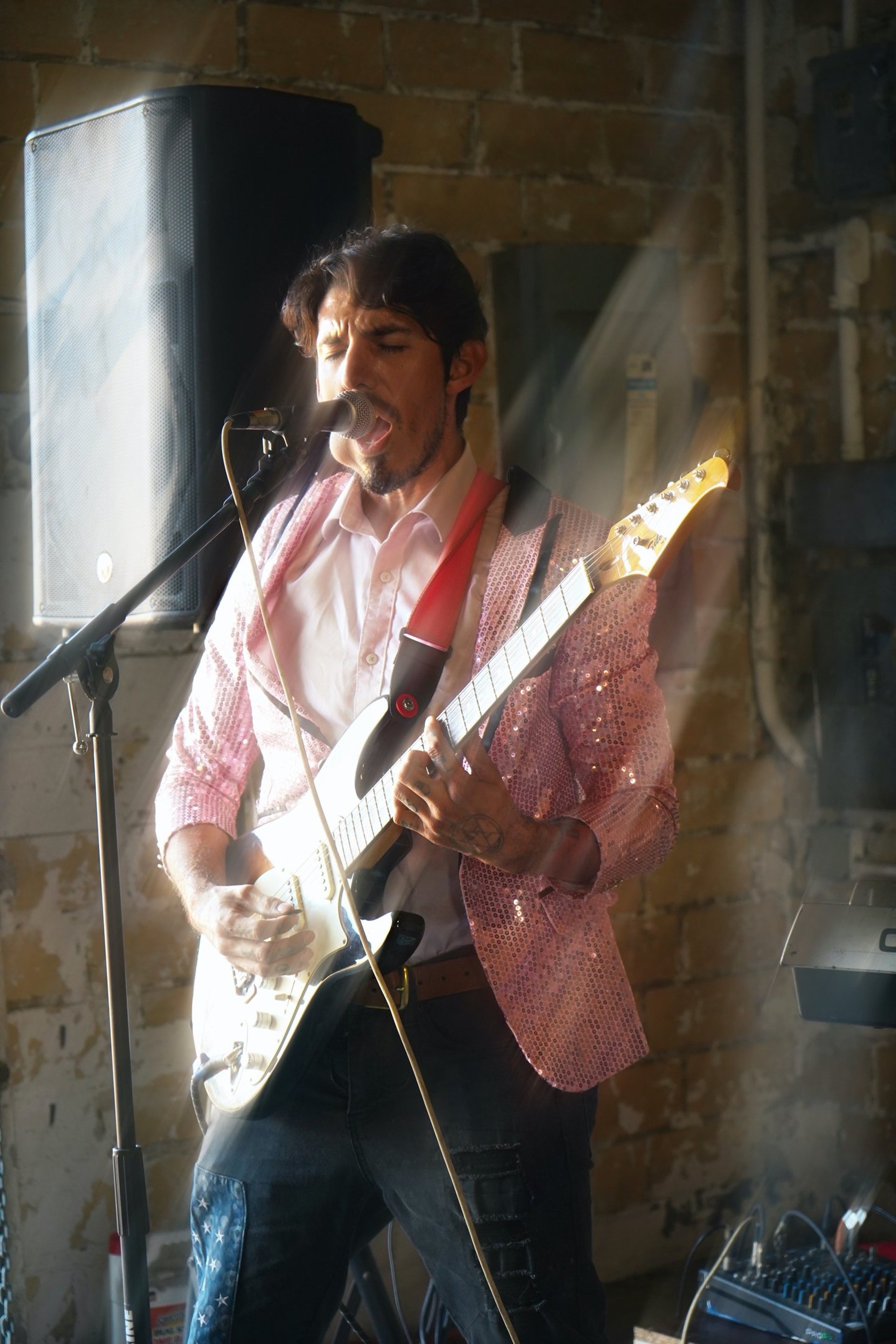 an abstract photo of a curved building with a blue sky in the background