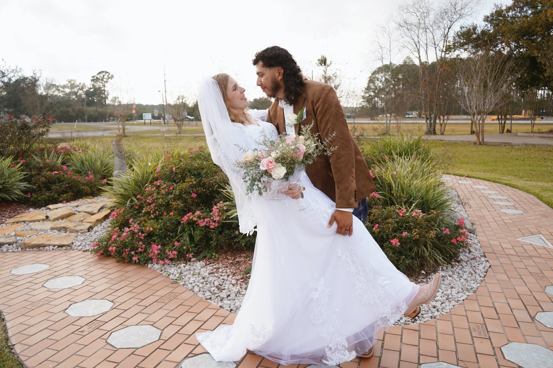 an abstract photo of a curved building with a blue sky in the background