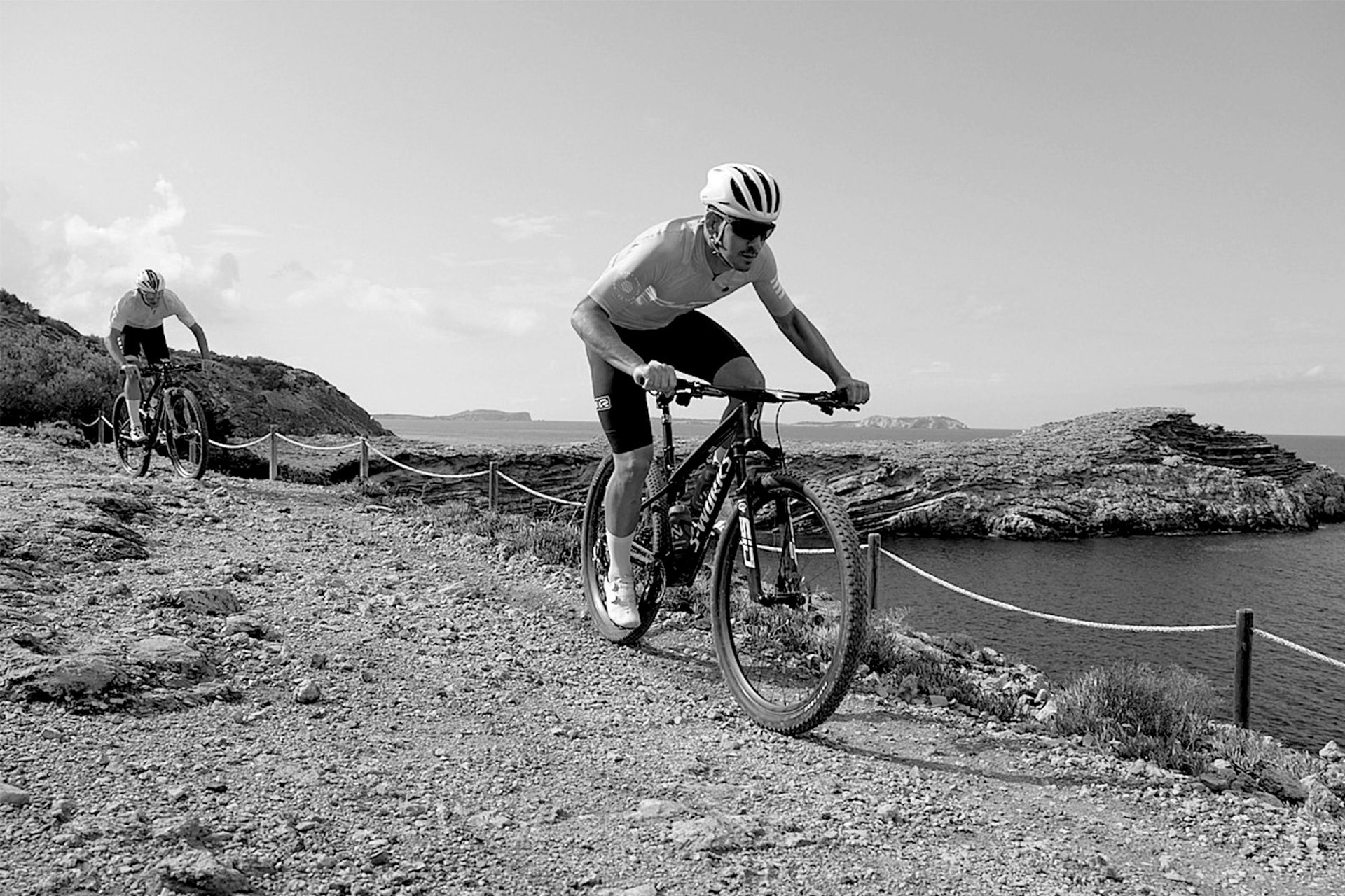 an abstract photo of a curved building with a blue sky in the background