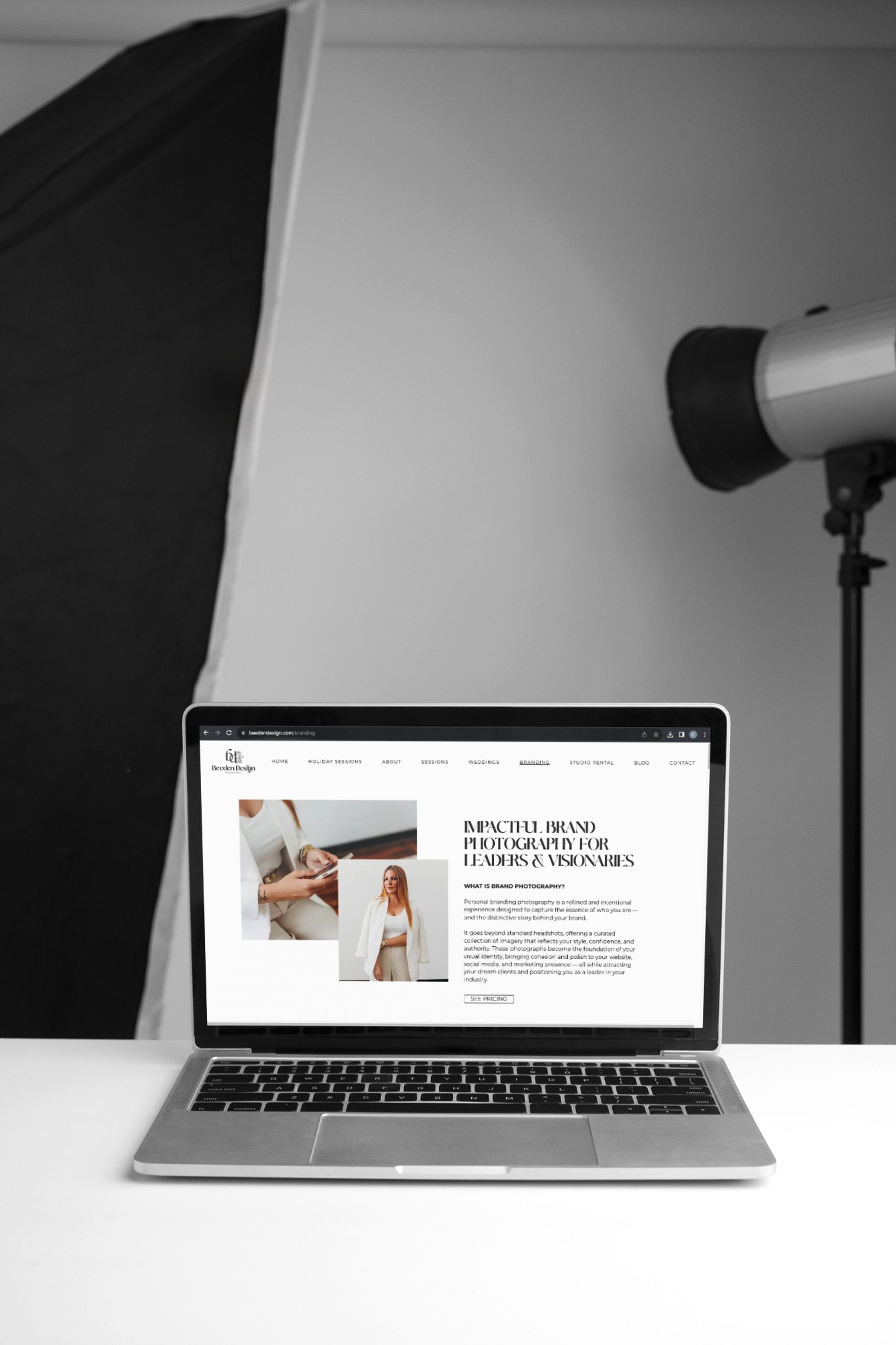 silver macbook on white table